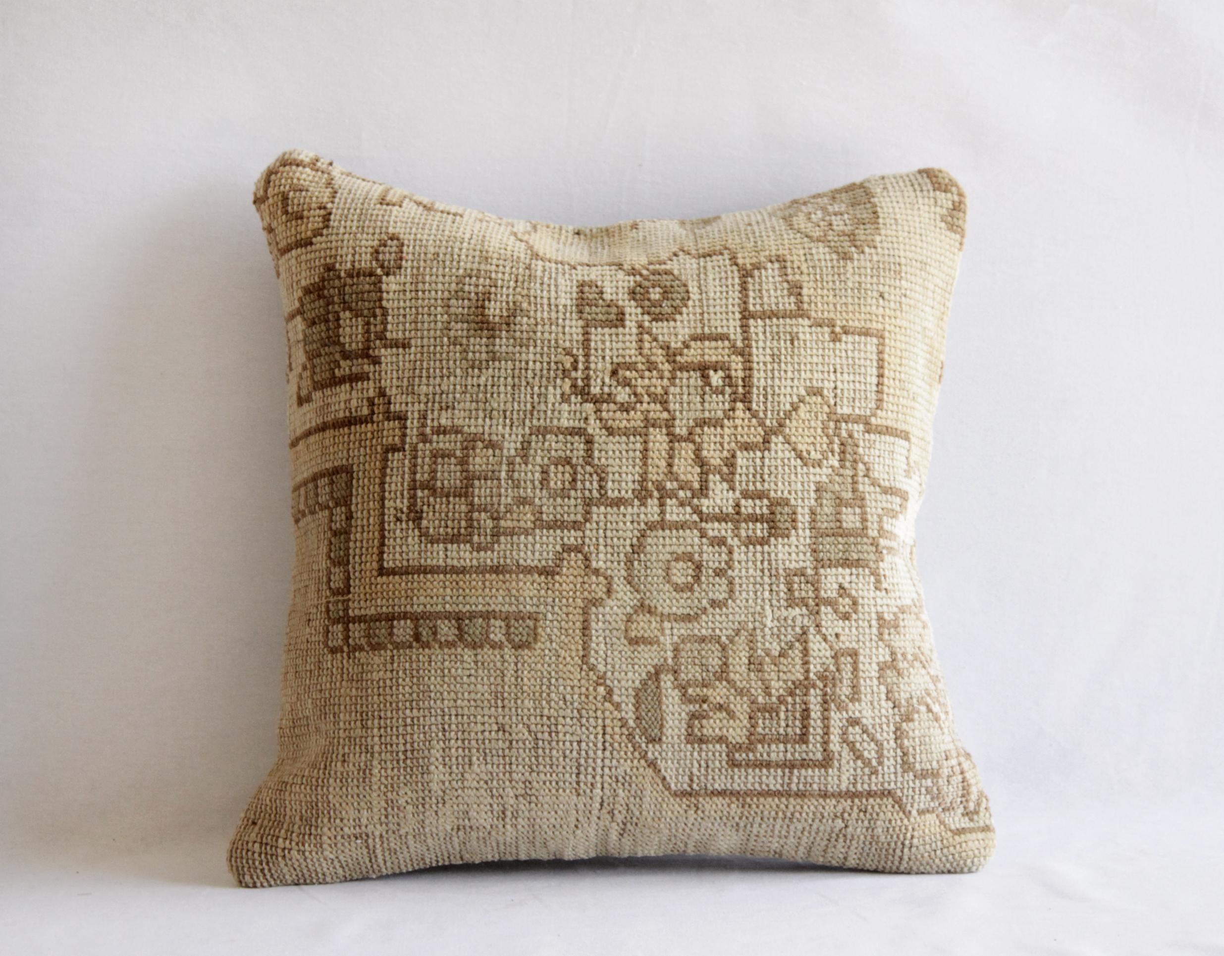 Vintage Turkish Kilim rug pillow in natural light earthy natural tones, with a beautiful pattern. 
Measures: 16 x 16 
 Backside is sewn with a natural coordinating canvas material. Insert not included. If you need an insert, we can add one for an