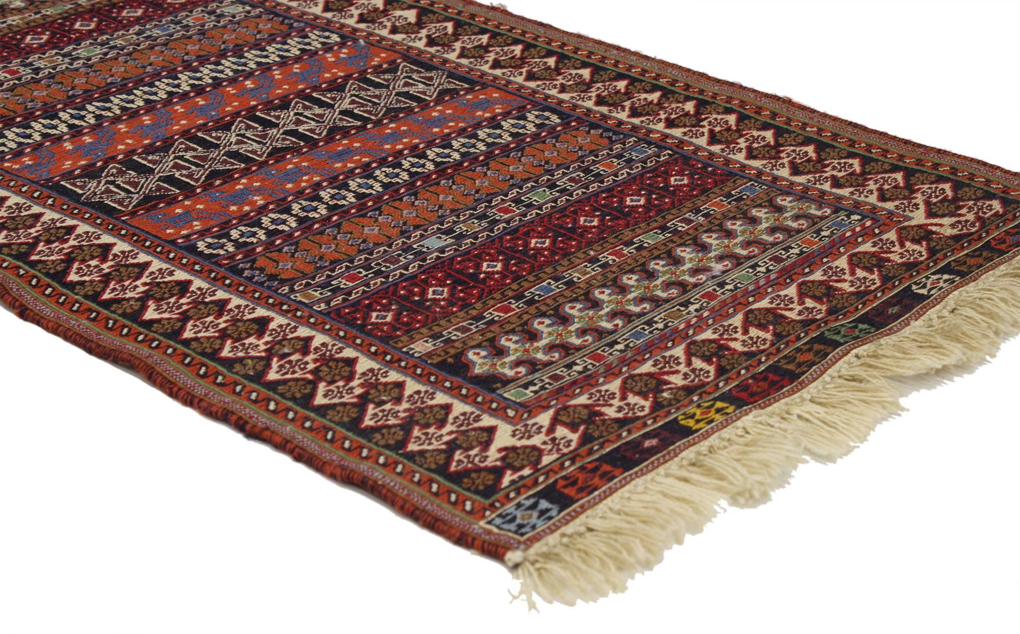 76986, vintage Turkish Kilim rug, small flat-weave rug. This handwoven wool vintage Turkish Kilim rug features an array of geometric tribal motifs. Intricate, colorful and full of ancient symbolism, this small flat-weave rug is well-curated,