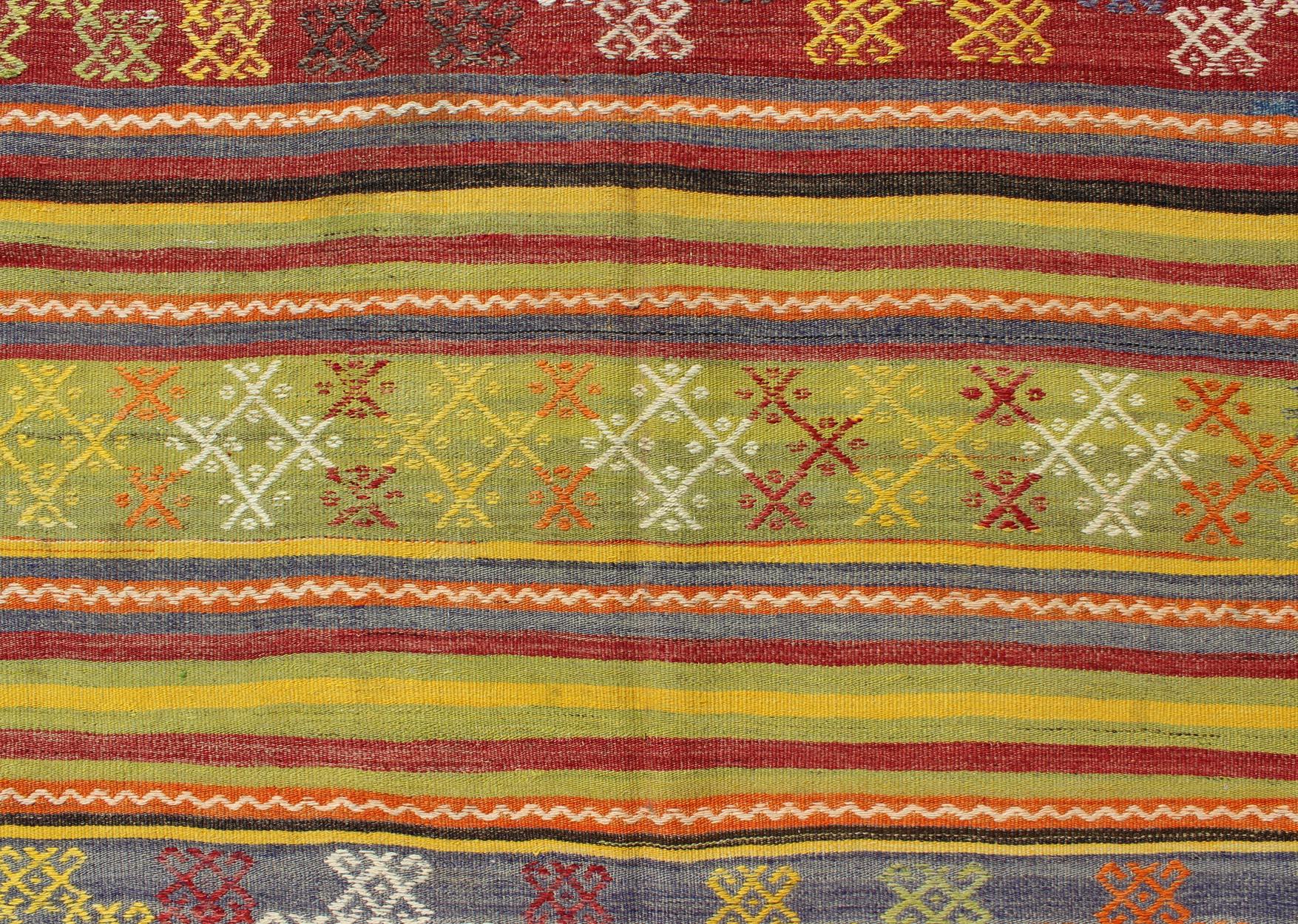 Wool Vintage Turkish Kilim Rug with Geometric Shapes and Colorful Horizontal Stripes For Sale