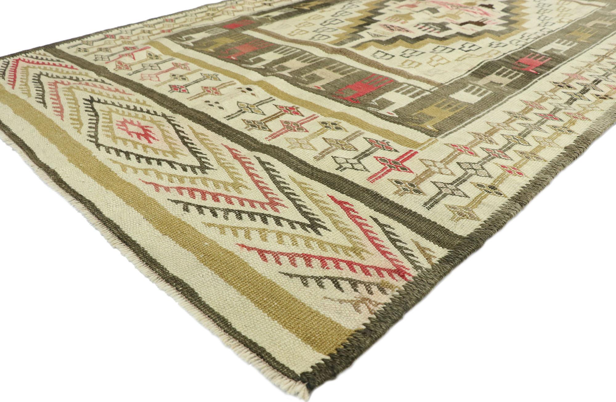 52725, vintage Turkish Kilim rug with rustic lodge style and modern tribal vibes. Masculine and geometric, this handwoven wool vintage Turkish Kilim rug features a central rectangle highlighting a stepped lozenge medallion patterned with ambiguous