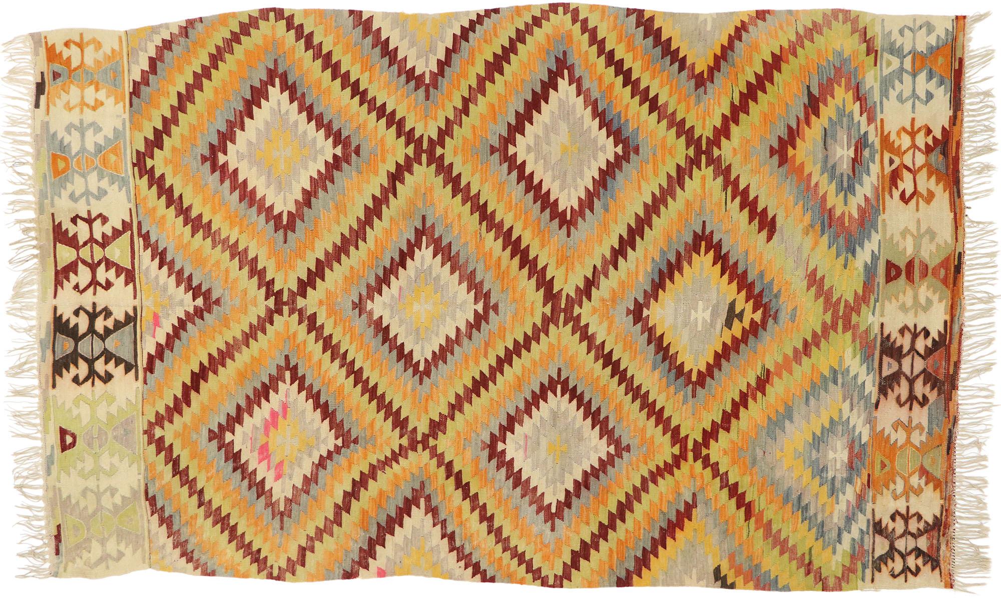 71061 Vintage Turkish Kilim Rug with Southwestern Desert Style. This hand-woven wool vintage Turkish Kilim rug features an all-over geometric trellis pattern composed of expanding lozenges creating a diamond lattice. The end caps beautifully display
