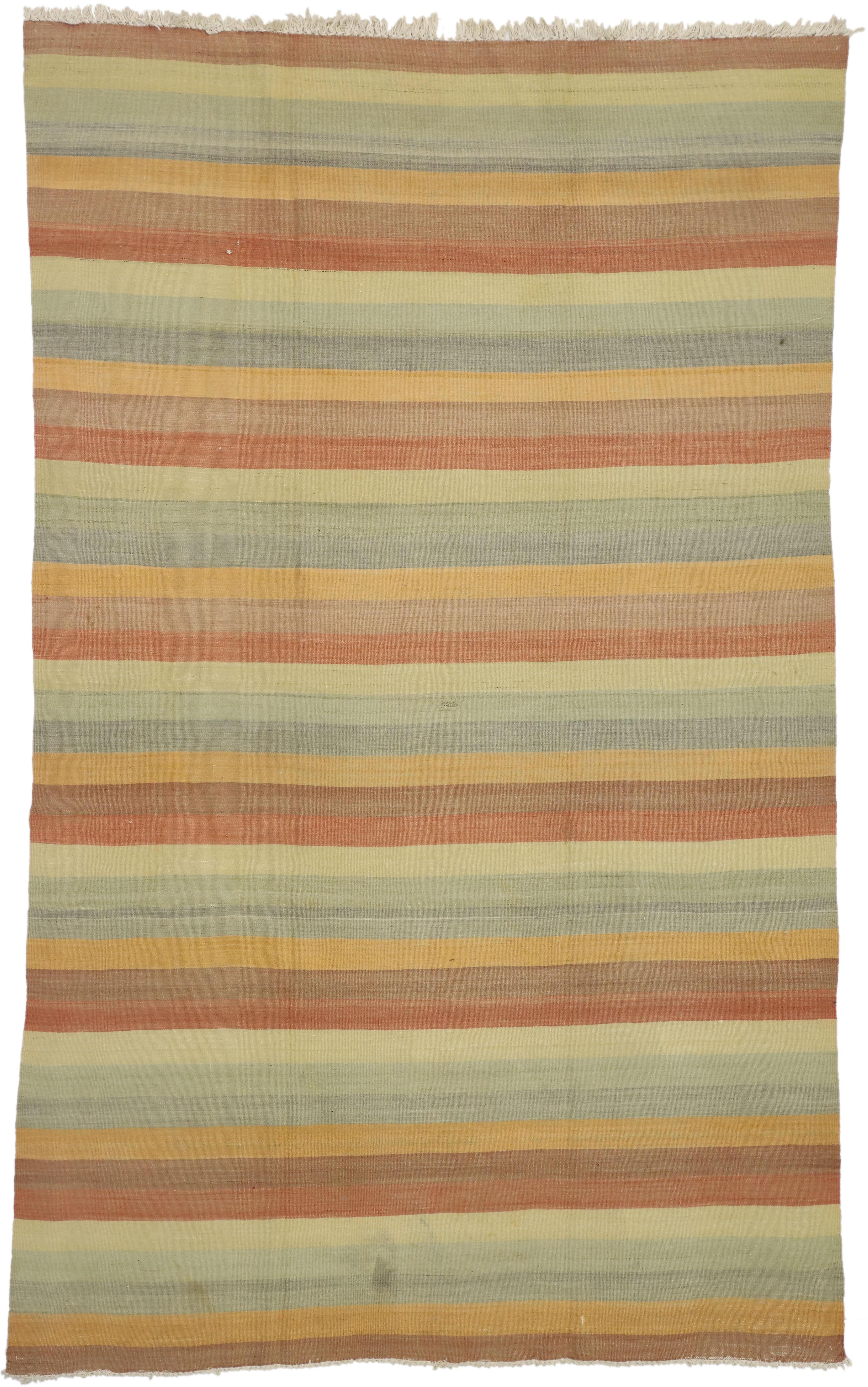51663 Vintage Turkish Kilim Rug with Stripes and Soft Colors, Flat-Weave Rug 06'04 x 10'02. Reflecting a striking color palette from nature and modern style, this hand-woven wool vintage kilim rug embodies a rustic modern cabin style. The field us