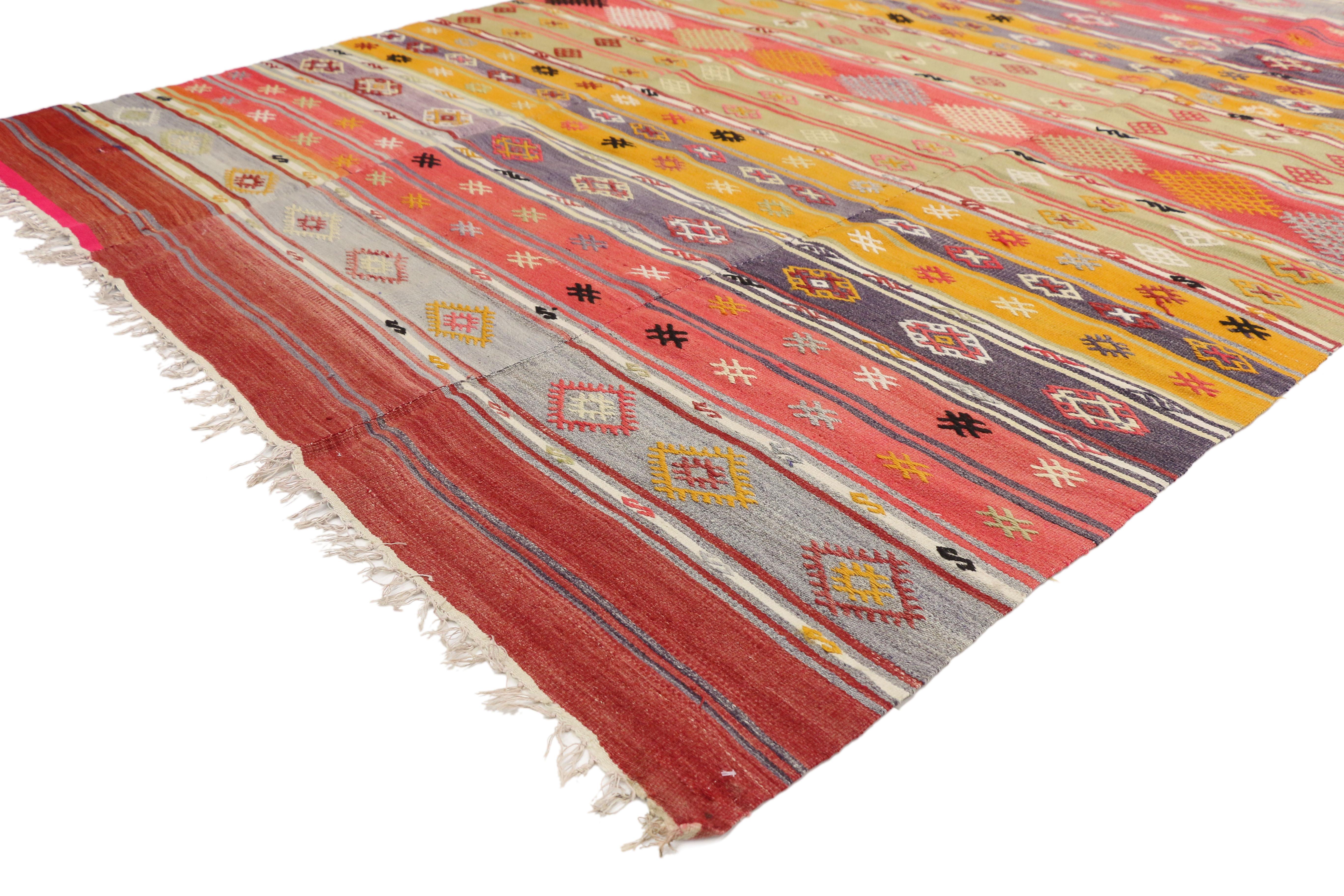 51275, vintage Turkish Kilim rug with tribal style boho chic flat-weave Kilim rug. This colorful handwoven wool vintage Turkish Kilim, flat-weave rug features stripes and geometric motifs. Rendered in variegated shades of ruby red, brick red, ruby