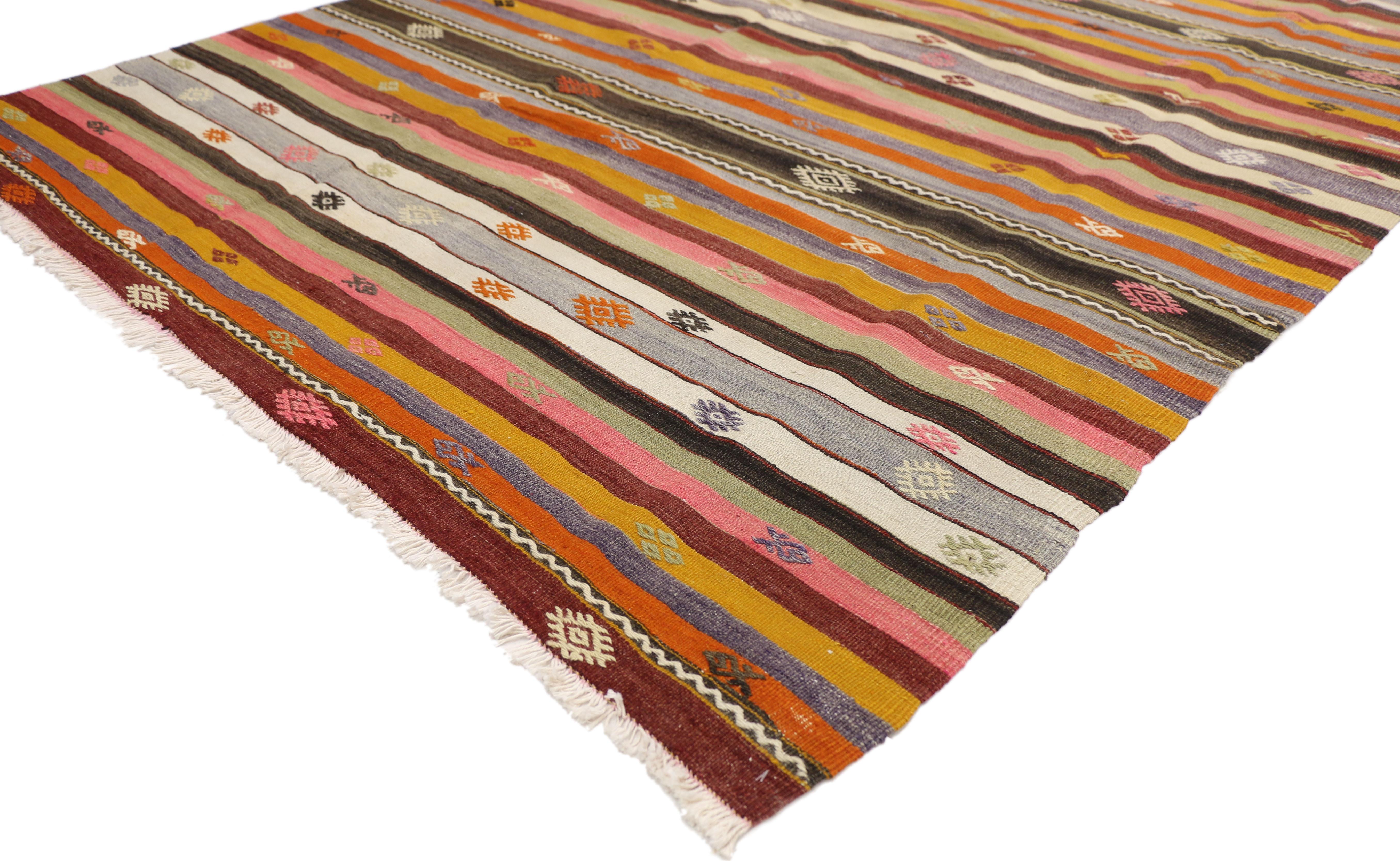 51283, vintage Turkish Kilim rug with tribal style boho chic flat-weave Kilim rug. This handwoven wool vintage Turkish Kilim rug features a series of stripes and bands with symbolic Turkish motifs. This flat-weave Kilim rug displays symbols of hook,