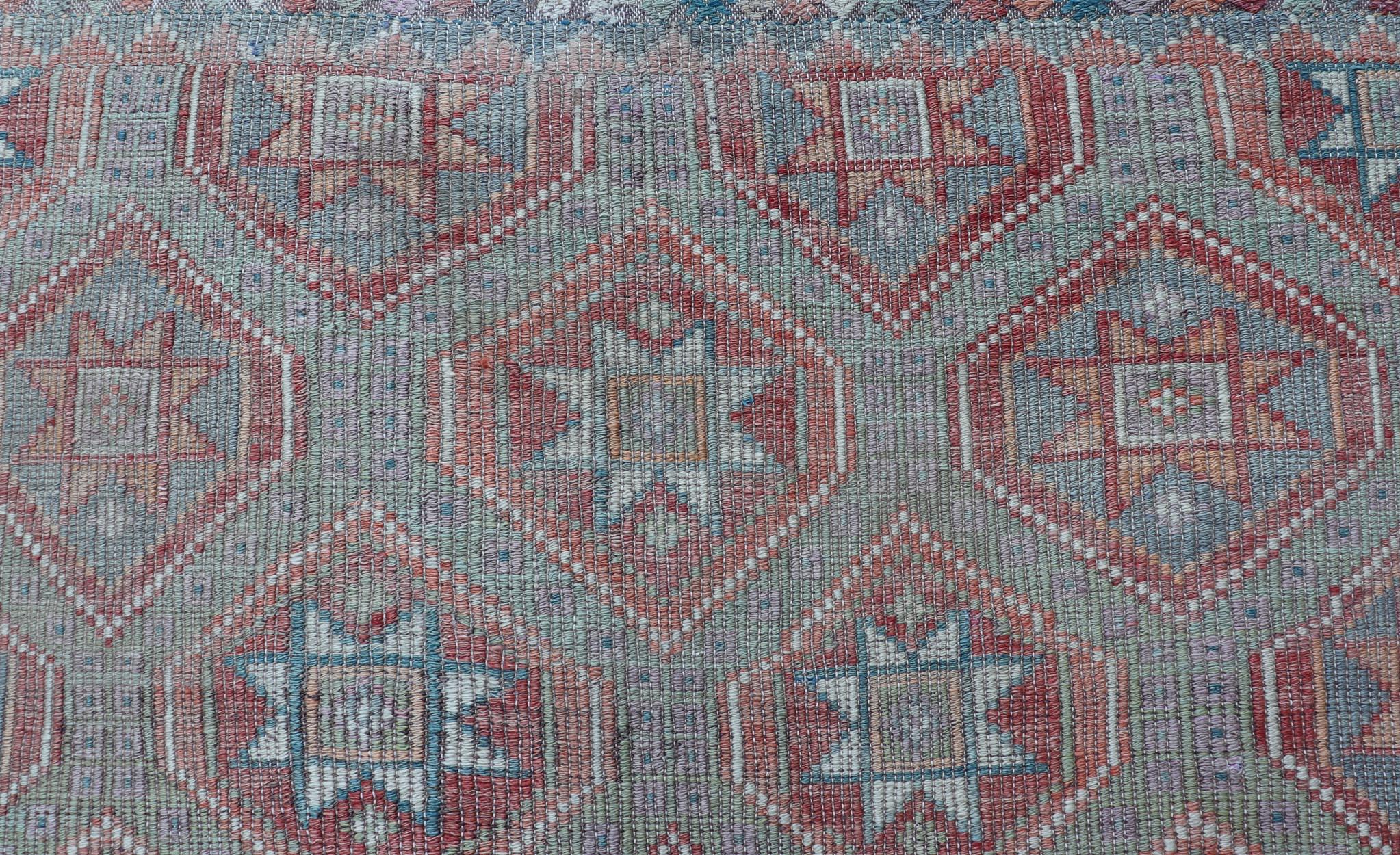 Measures: 6'0 x 9'3 
Vintage Turkish Kilim Rug With Vibrant Star Geometric Patterns 6'0 x 9'3,
Keivan Woven Arts / Rug / EN-15559 Country of origin / type: Turkey / Kilim. 

Vintage Turkish kilim rug showcases a vibrant display of geometric patterns