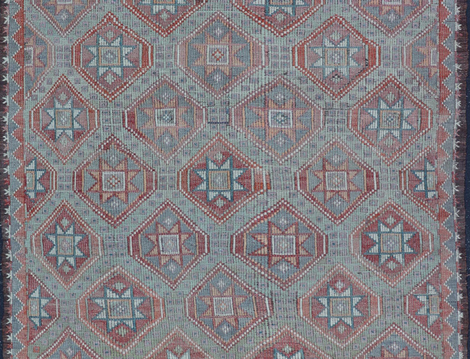 Vintage Turkish Kilim Rug With Vibrant Star Geometric Patterns 6'0 x 9'3 In Good Condition For Sale In Atlanta, GA