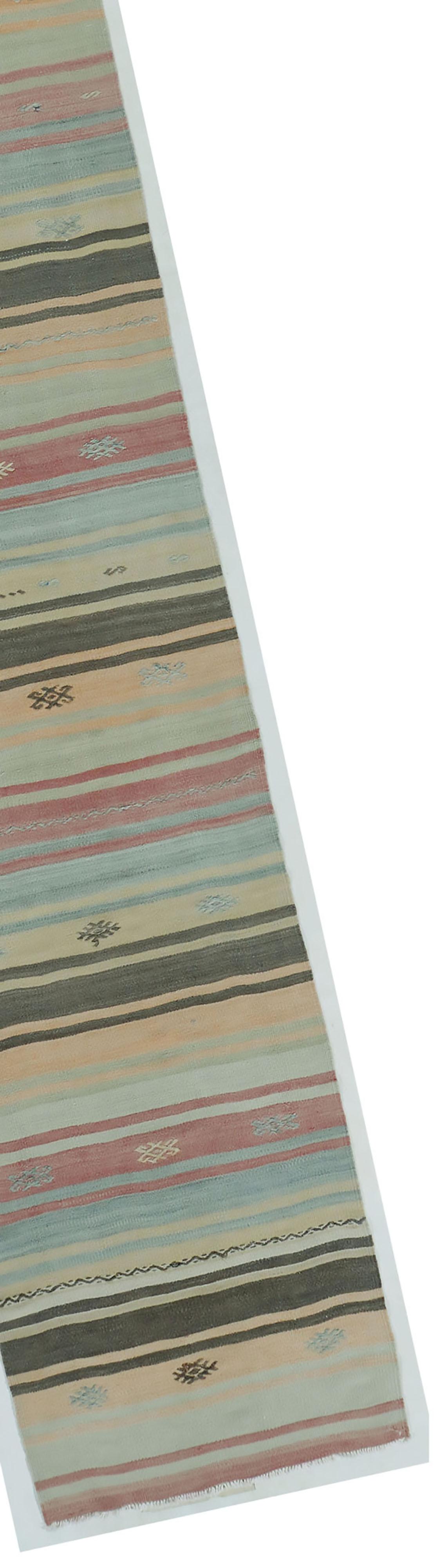 Vintage Turkish Kilim Runner 2'6 X 13'4. A vintage circa 1940s Turkish hand woven hemp Kilim. The simplicity and boldness of this piece gives a contemporary feel and can look at home in both a modern or traditional setting.
