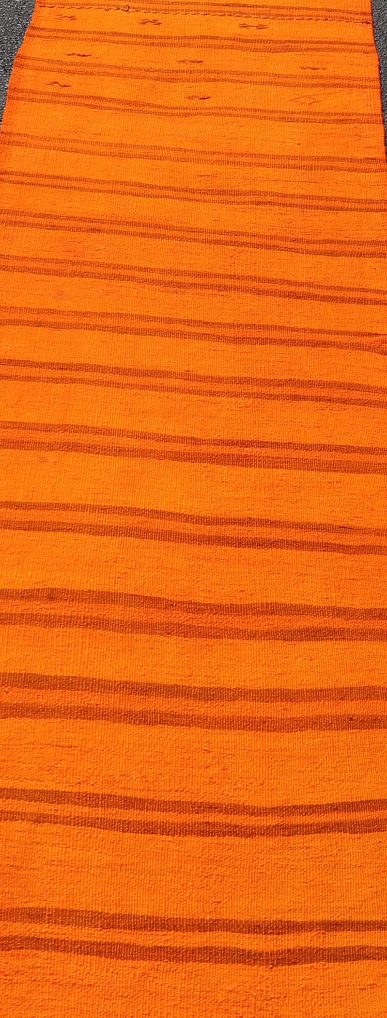 Measures: 2'9 x 12'0 Vintage Turkish Kilim Runner -Vibrant Orange Stripes and Rustic Charm Keivan Woven Arts / Rug / EN-14122 Country of origin / type: Turkey / Kilim Vintage Turkish Kilim Runner radiates warmth and energy -its strikingly vibrant