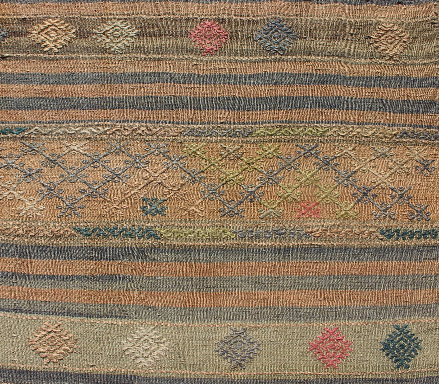 Wool Vintage Turkish Kilim Runner with Geometric Design and Colorful Stripes For Sale