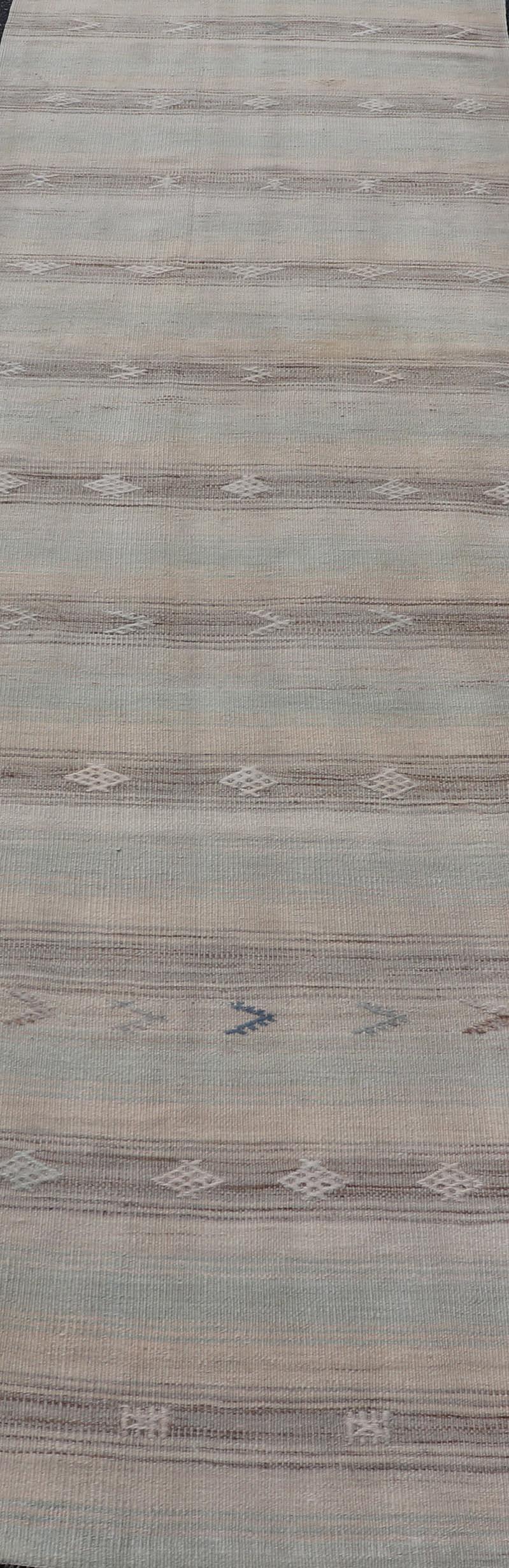 Vintage Kilim runner in stripes and tribal motifs, with embroideries in taupe, light brown, light teal and light green, Keivan Woven Arts rug EN-179377, country of origin / type: Turkey / Kilim, circa Mid-20th Century.

Measures: 2'8 x 10'10.