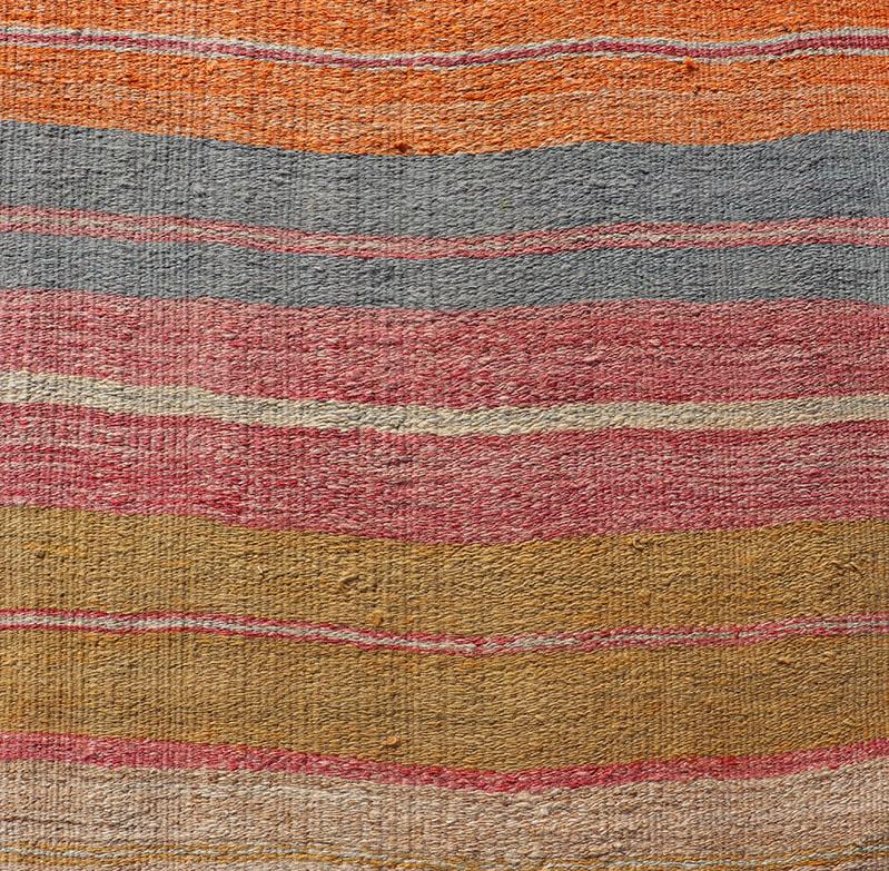 Vintage Turkish Kilim Runner with horizontal stripes in bright color tones. Keivan Woven Arts / rug EN-P13699, country of origin / type: Turkey / Kilim, circa Mid-20th Century.

Featuring a striped design in a repeating horizontal lines across the