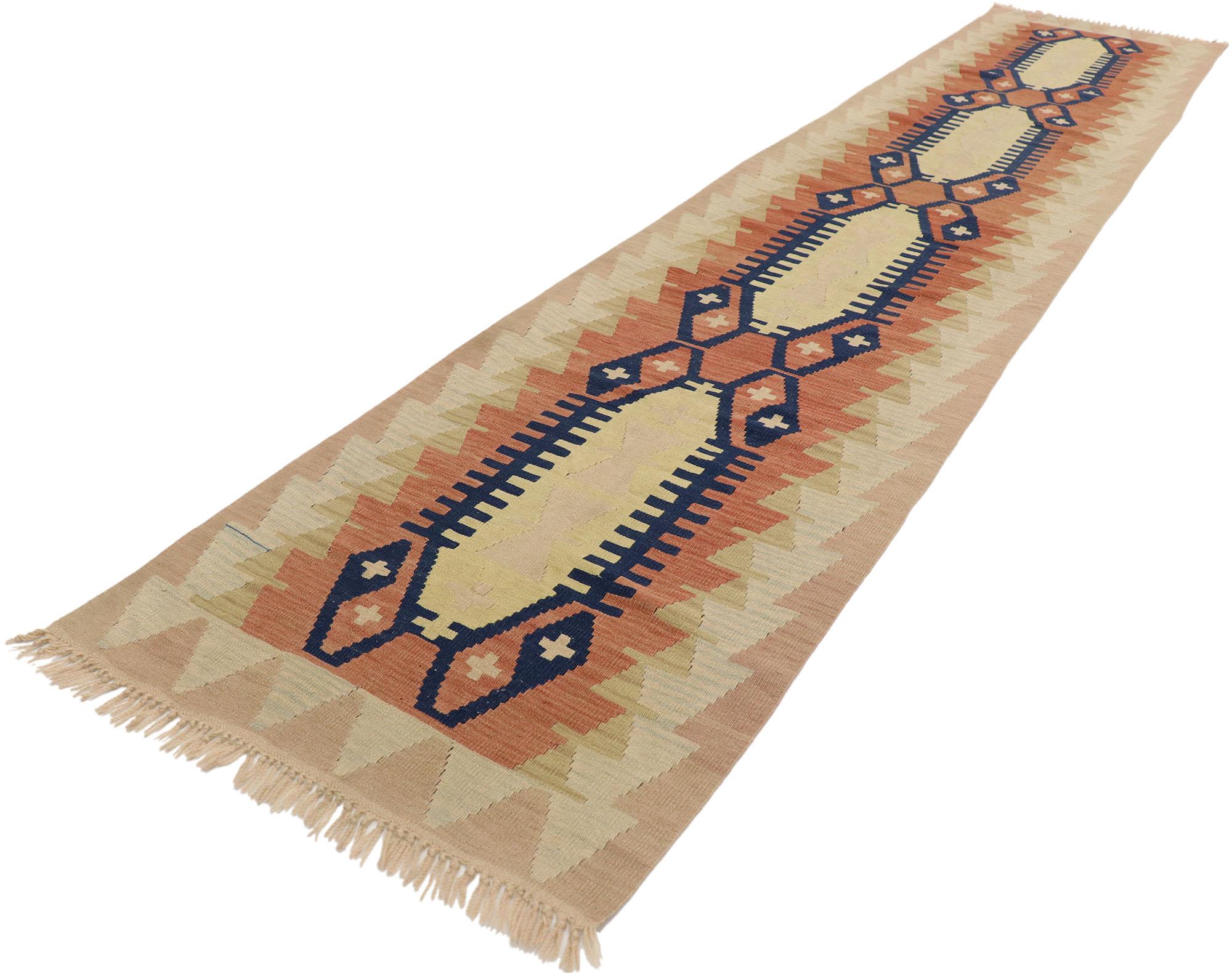 53113, vintage Turkish Kilim runner with Southwestern Desert Bohemian style. Rugged beauty and simplicity meet tribal charm with a southwest desert bohemian style in this handwoven wool vintage Turkish Kilim runner. It features an all-over geometric