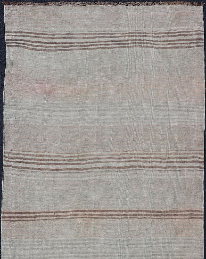 Vintage Turkish Kilim Runner, Keivan Woven Arts / rug EN-P13759, country of origin / type: Turkey / Kilim, circa Mid-20th century.

This vintage flat-woven kilim runner features a minimalist design rendered in thin brown stripes, set atop a taupe