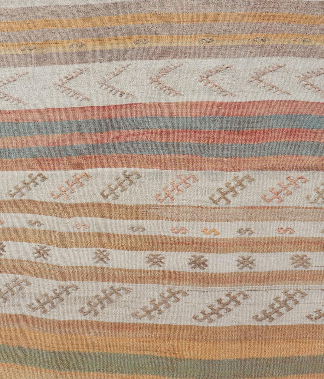 Vintage Turkish Kilim Runner with Stripes in Cream, Lt Green, Coral & Yellow. Keivan Woven Arts / rug EN-179866, country of origin / type: Turkey / Kilim, circa Mid-20th Century.
Measures: 3'2 x 15'0 
This vintage flat-woven kilim runner features a