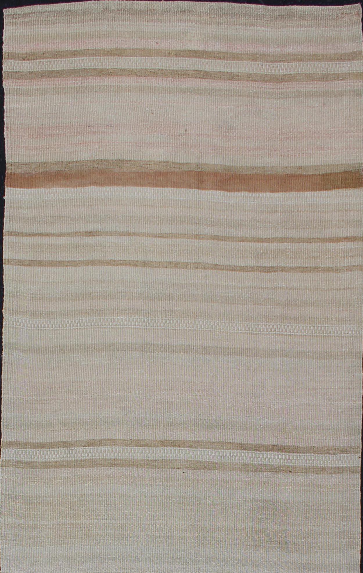 Stripe design Kilim runner in cream, light green, brown, rug EN-179080, country of origin / type: Turkey / Kilim, circa 1950

This flat-woven Kilim runner from Turkey features an exciting composition consisting of stripes rendered in natural tones
