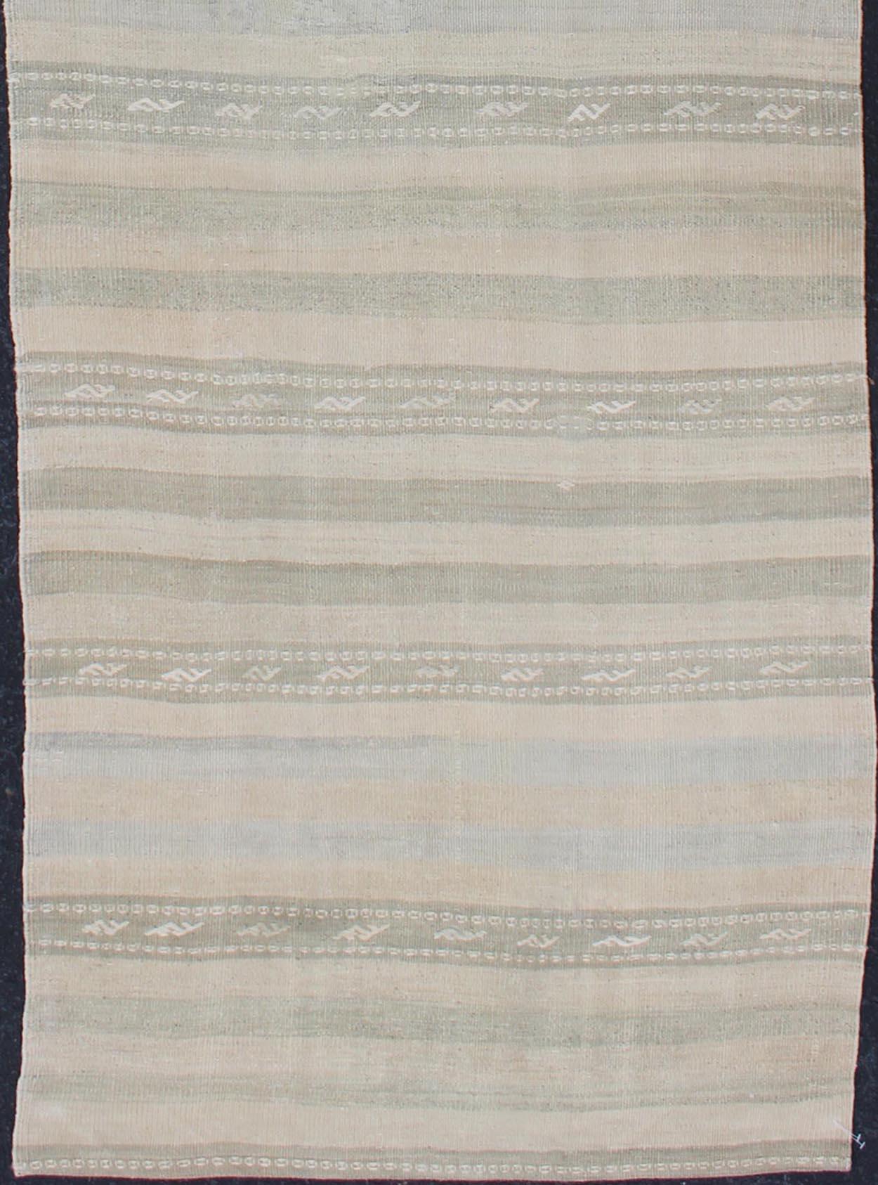 Stripe design Kilim runner in cream, light green, taupe, rug EN-179274, country of origin / type: Turkey / Kilim, circa 1950

This flat-woven Kilim runner from Turkey features an exciting composition consisting of stripes rendered in natural tones