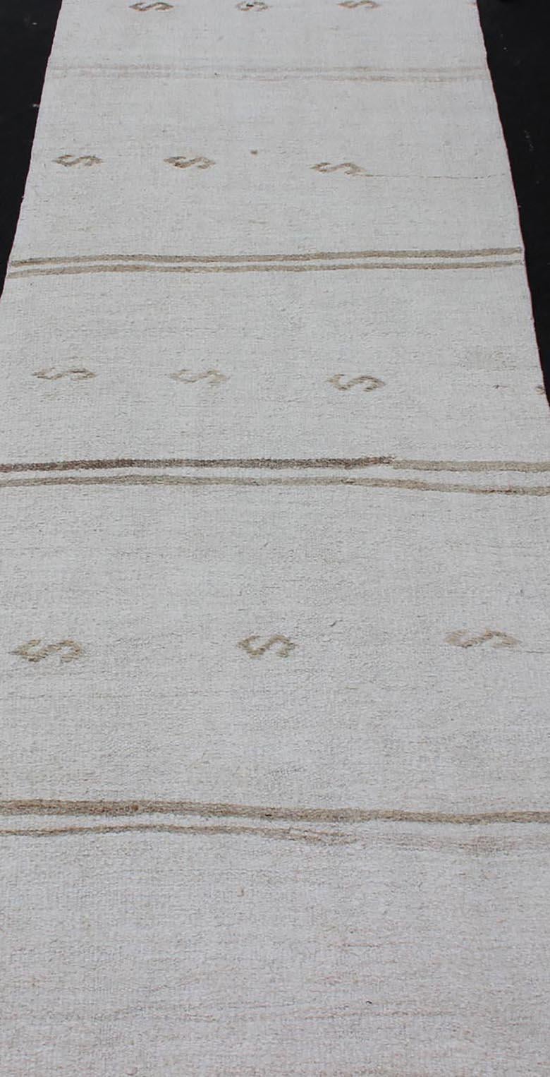 Vintage Turkish Kilim Runner with Stripes in Off White & Light brown. Keivan Woven Arts / rug TU-NED-1207, country of origin / type: Turkey / Kilim, circa 1950

Measures: 2'7 x 11'10 

This flat-woven Kilim runner from Turkey features an random