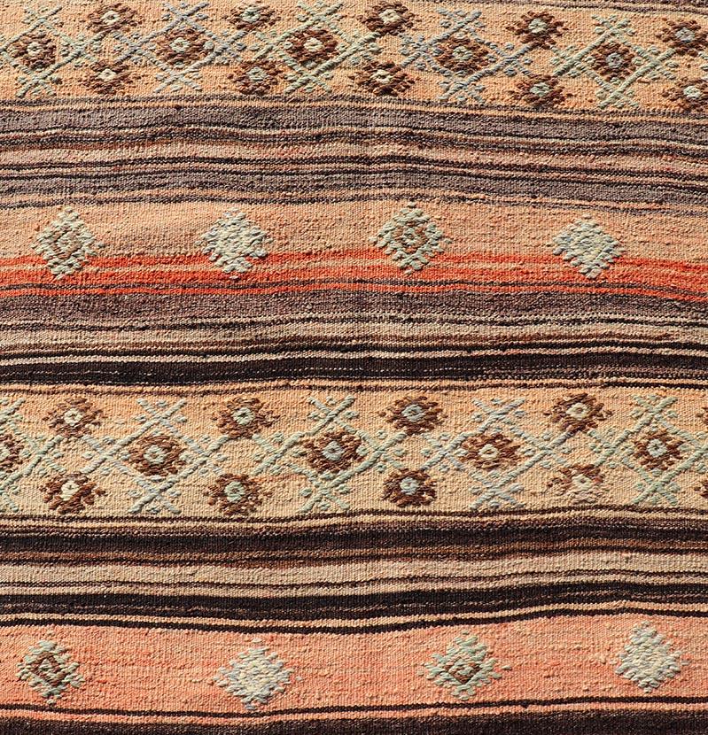 Measures: 3'1 x 11'7 
Vintage Turkish Kilim Runner with Stripes in Tan, Brown, and Orange. Keivan Woven Arts / rug TU-NED-5042, country of origin / type: Turkey / Kilim, circa Mid-20th Century.
This vintage flat-woven kilim runner features a