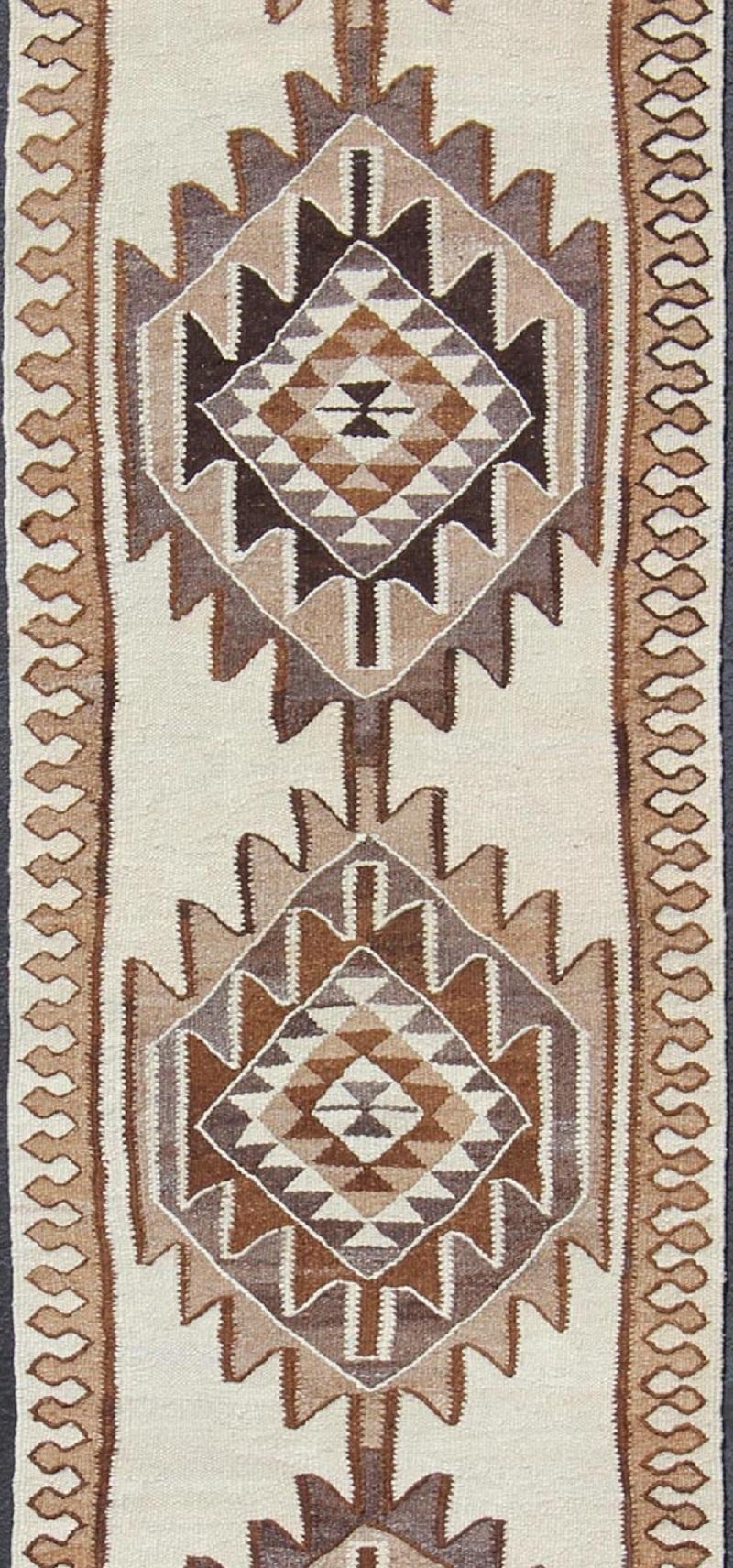 Hand-Woven Vintage Turkish Kilim Runner with Tribal Medallions in Shades of Brown and Cream For Sale
