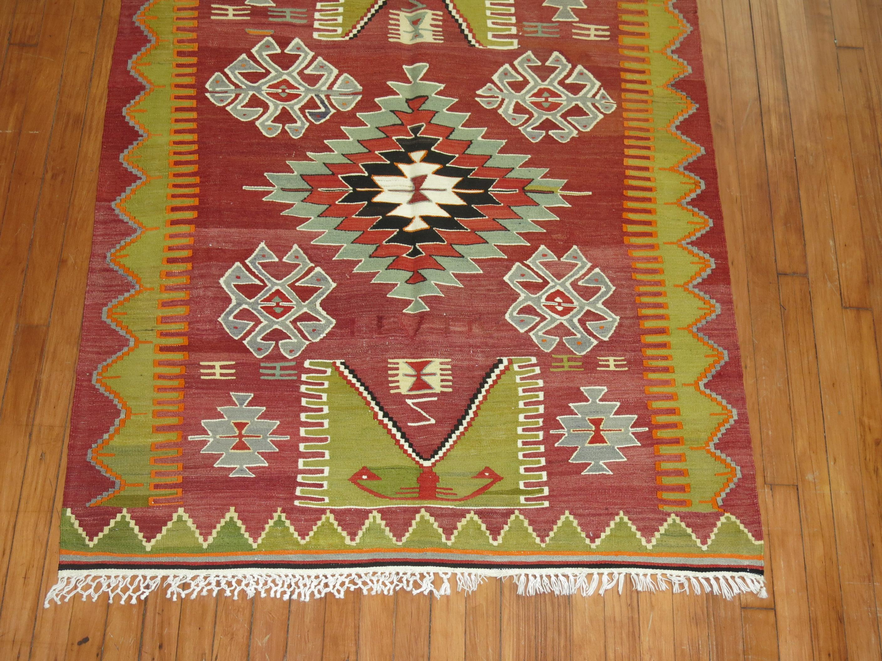 Colorful mid-20th century Turkish flat-weave Kilim.

3'11'' x 5'1''