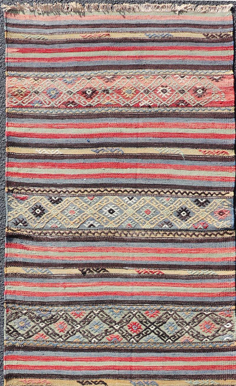 Hand-Woven Vintage Turkish Kilim with Horizontal Stripes and Tribal Motifs in Bright Tones For Sale