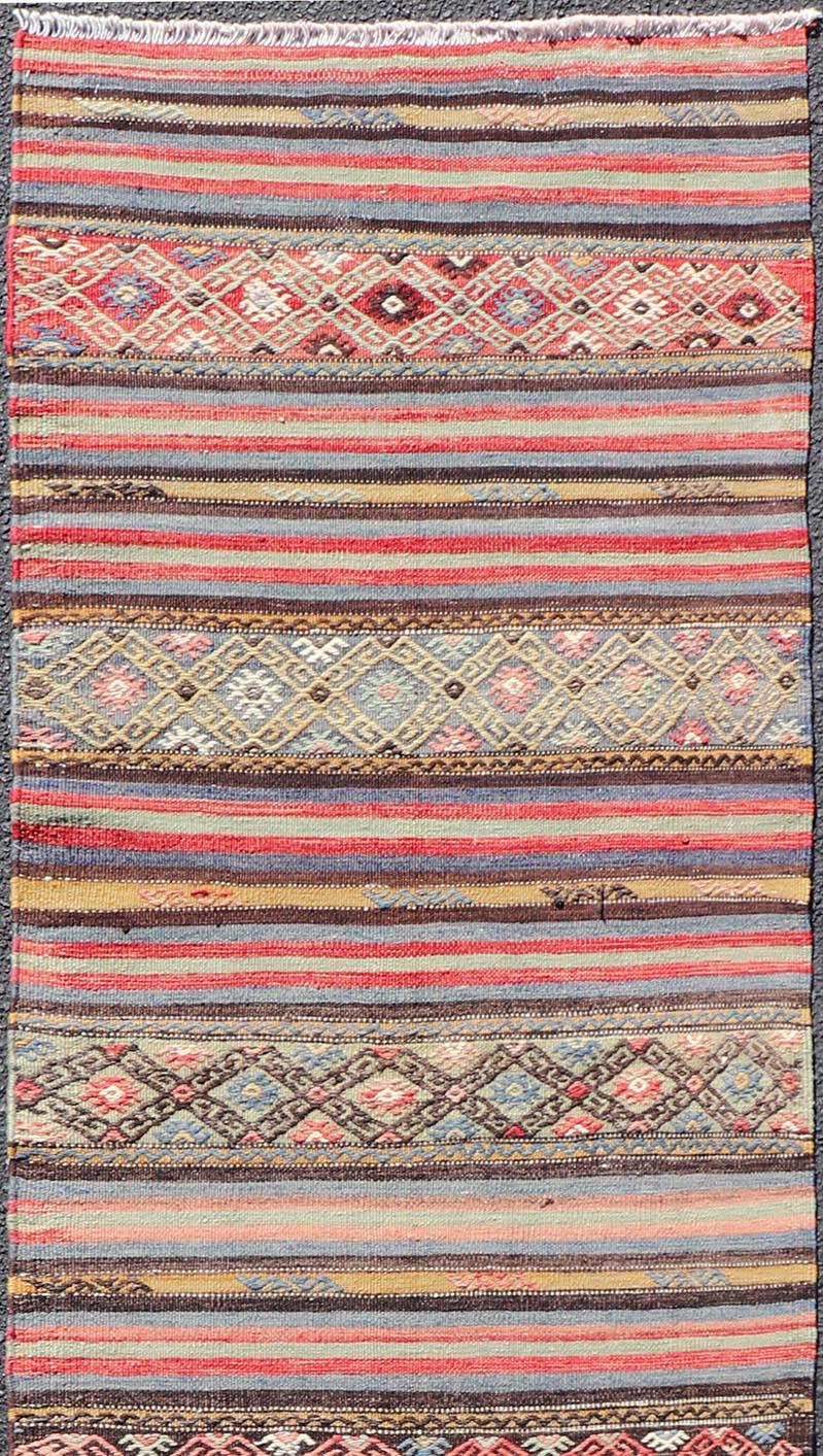 Hand-Woven Vintage Turkish Kilim with Horizontal Stripes and Tribal Motifs in Bright Tones For Sale