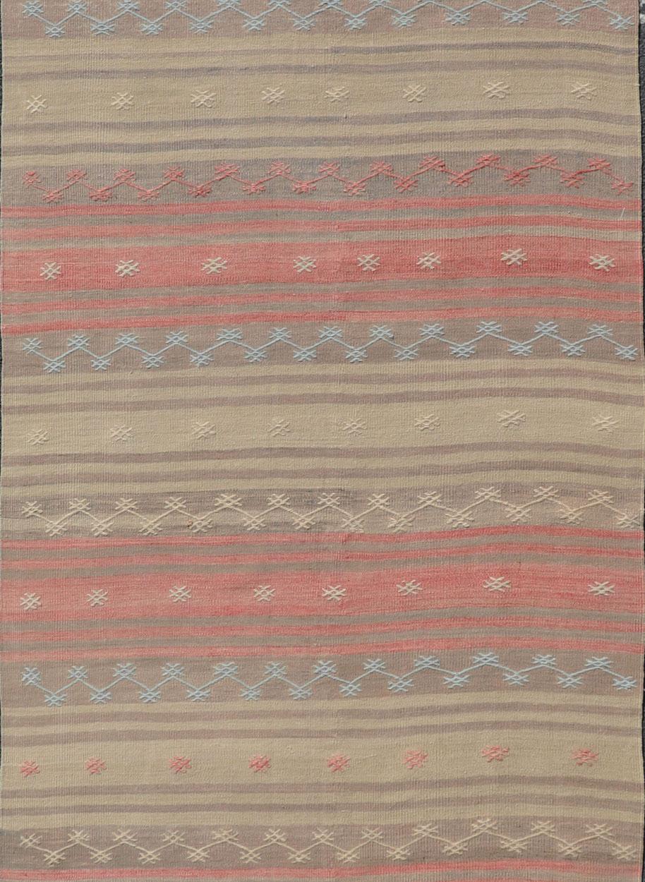 Multicolored vintage Turkish Kilim rug with horizontal stripes in tan, blue, brown and orange. Keivan Woven Arts / Vintage Turkish Kilim, rug EN-P13774, country of origin / type: Turkey / Kilim, circa Mid-20th century.

Featuring a repeating