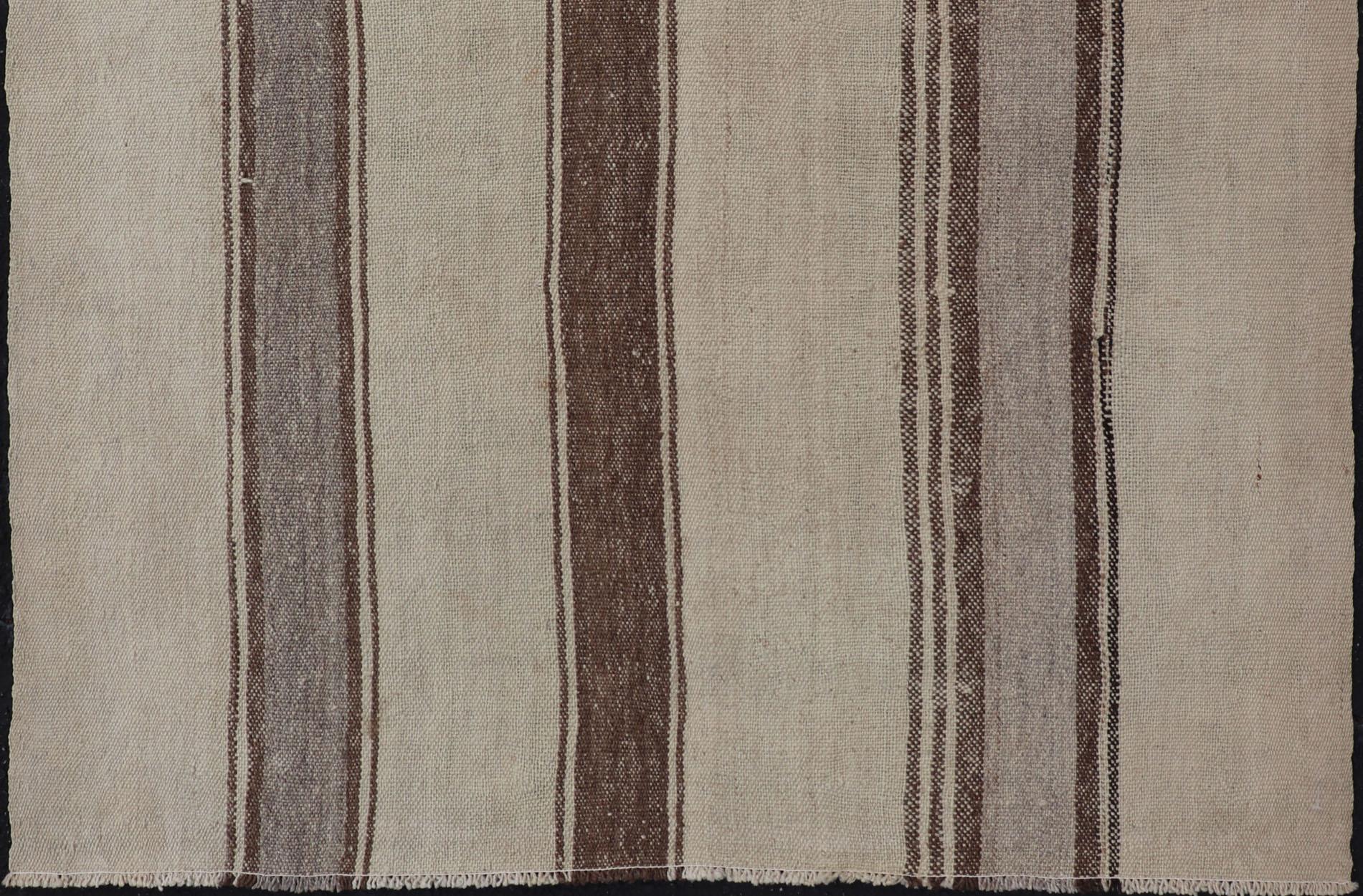 Vintage Kilim small rug in tan, gray, taupe, cream & brown. Keivan Woven Arts rug EN-178677, country of origin / type: Turkey / Kilim, circa mid-20th century.

Measures: 4'3 x 5'7.