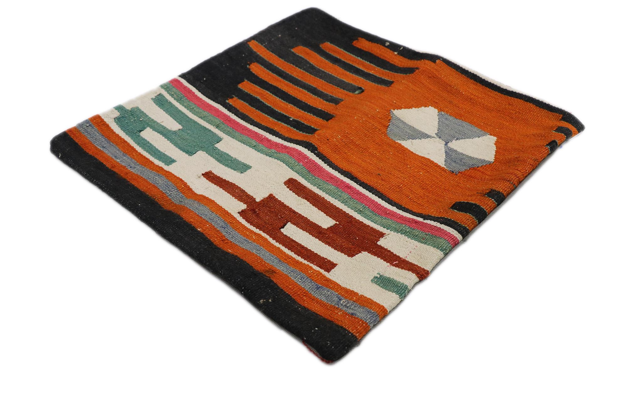 53634 Vintage Turkish Kilim Rug Pillow Cover, 01'06 x 01'06. This handwoven wool vintage Turkish kilim rug pillow cover captivates with its vibrant and dynamic tribal design, inviting the spirit of nomadic wanderlust into nearly any space. This