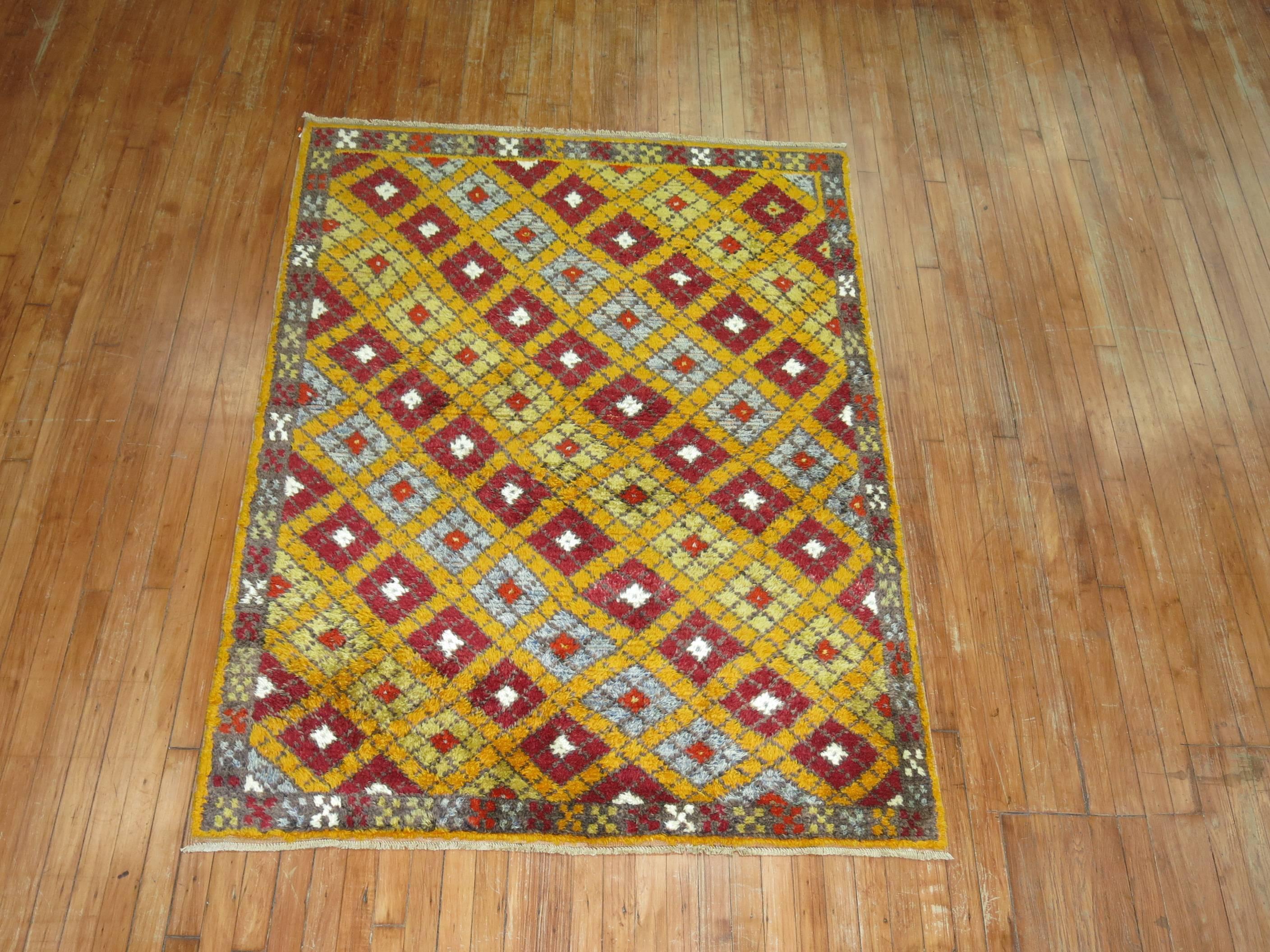 Saffron colored field vintage Turkish Konya rug.