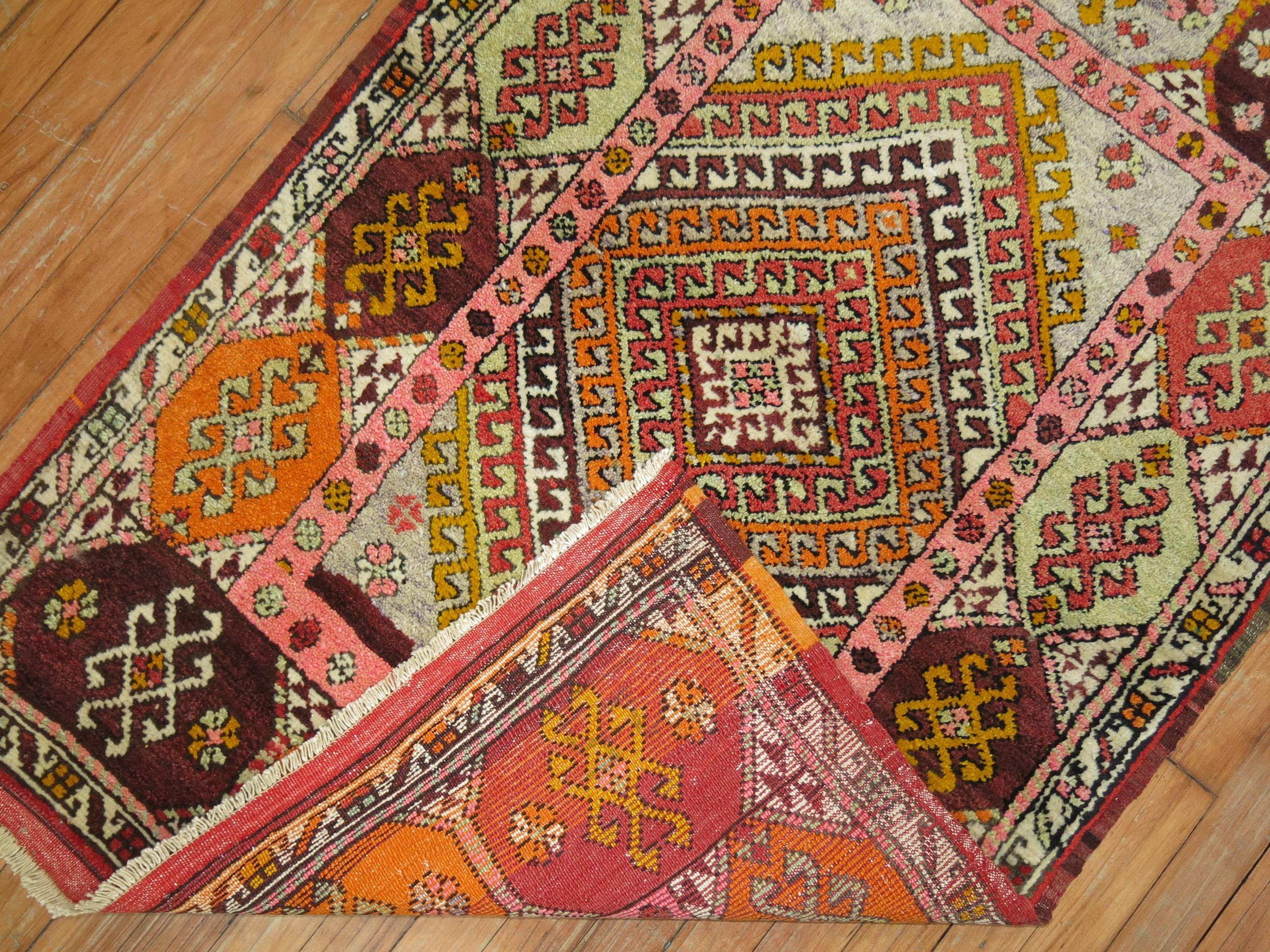 Colorful vintage Turkish Konya rug from the mid-20th century.