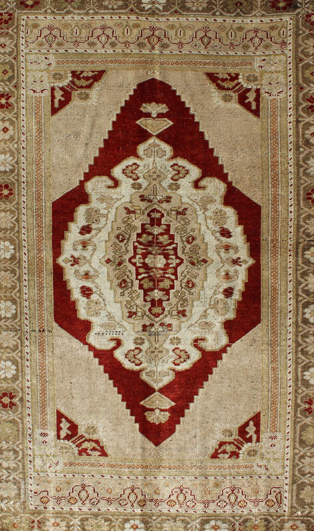 Vintage Turkish Layered Medallion Oushak Rug in Dark Red and Neutrals In Good Condition For Sale In Atlanta, GA