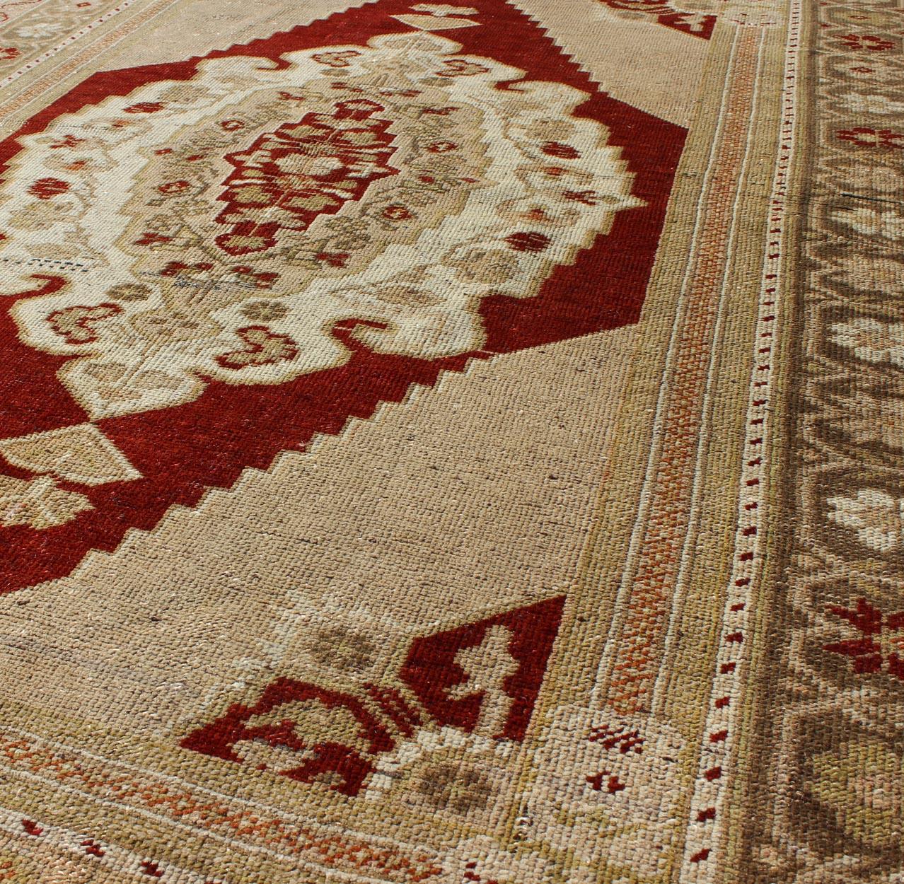 20th Century Vintage Turkish Layered Medallion Oushak Rug in Dark Red and Neutrals For Sale