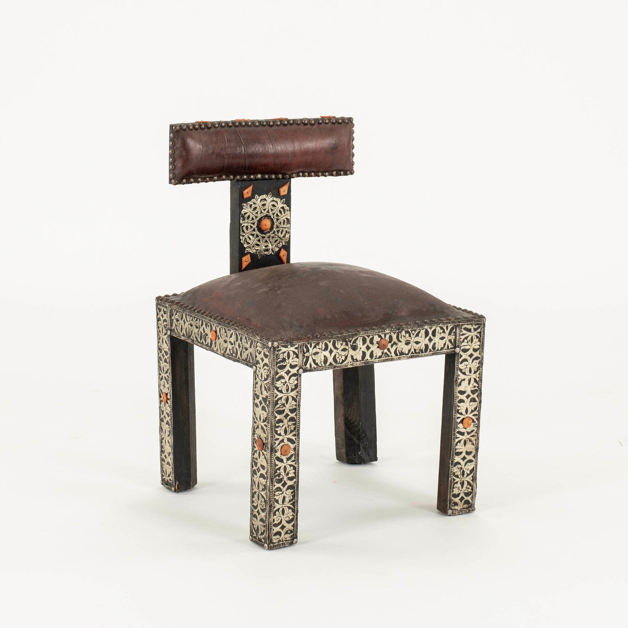 20th Century Turkish wood chair from Instanbul features a leather and is adorned with  metal filigree and hand carved bone tiles.