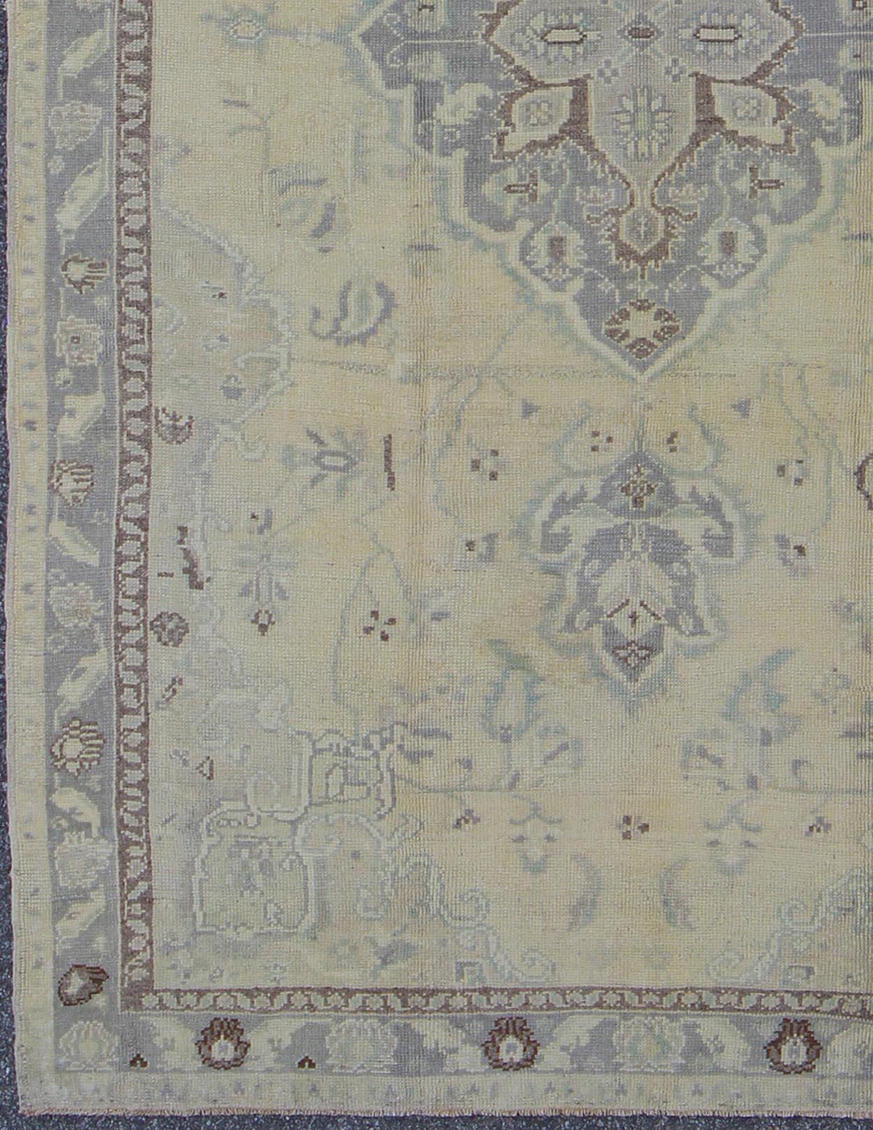 Hand-Knotted Vintage Turkish Medallion Oushak in Muted Yellow, Blue, Green, Peach & Lilac For Sale