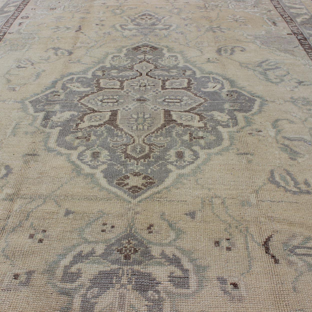 20th Century Vintage Turkish Medallion Oushak in Muted Yellow, Blue, Green, Peach & Lilac For Sale