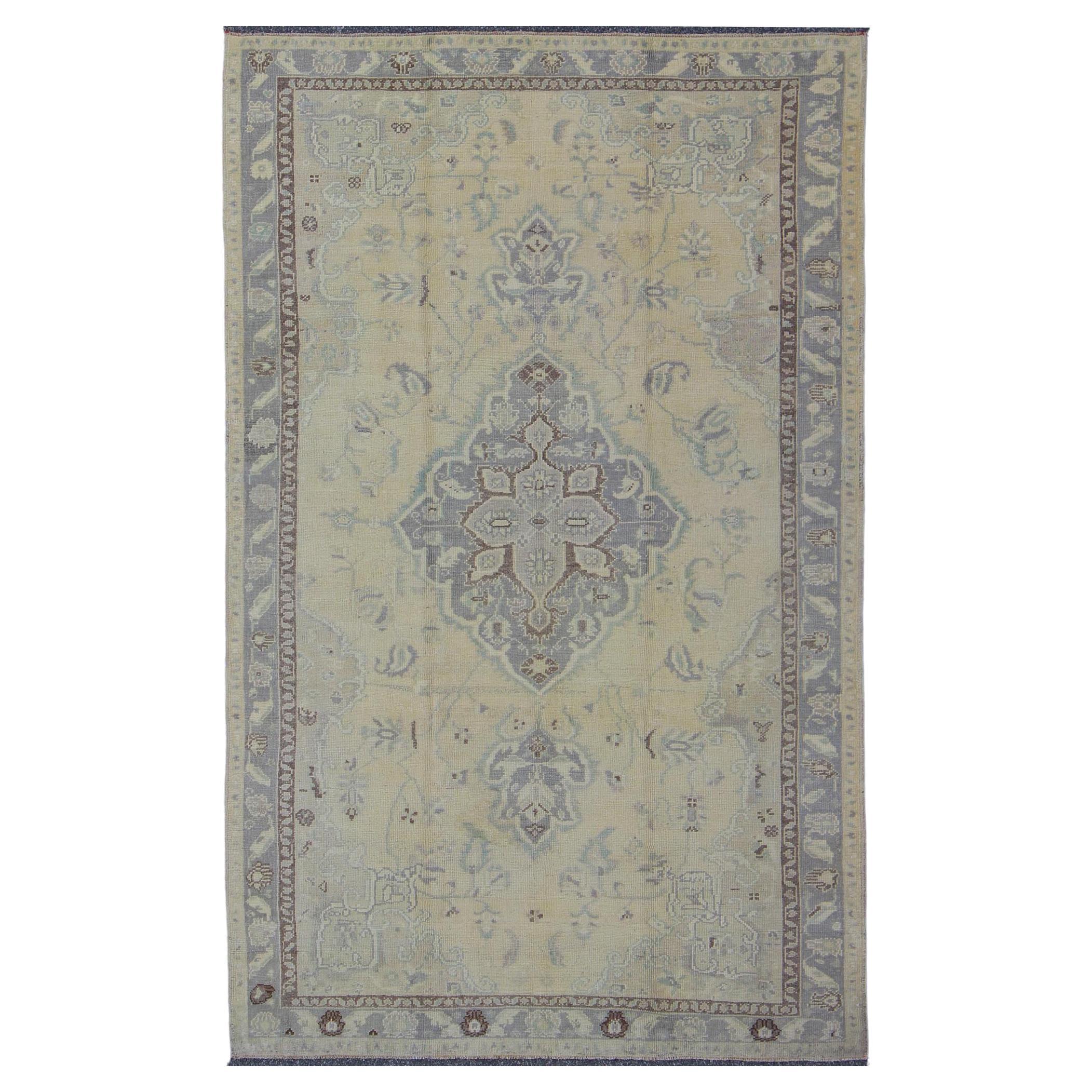 Vintage Turkish Medallion Oushak in Muted Yellow, Blue, Green, Peach & Lilac For Sale