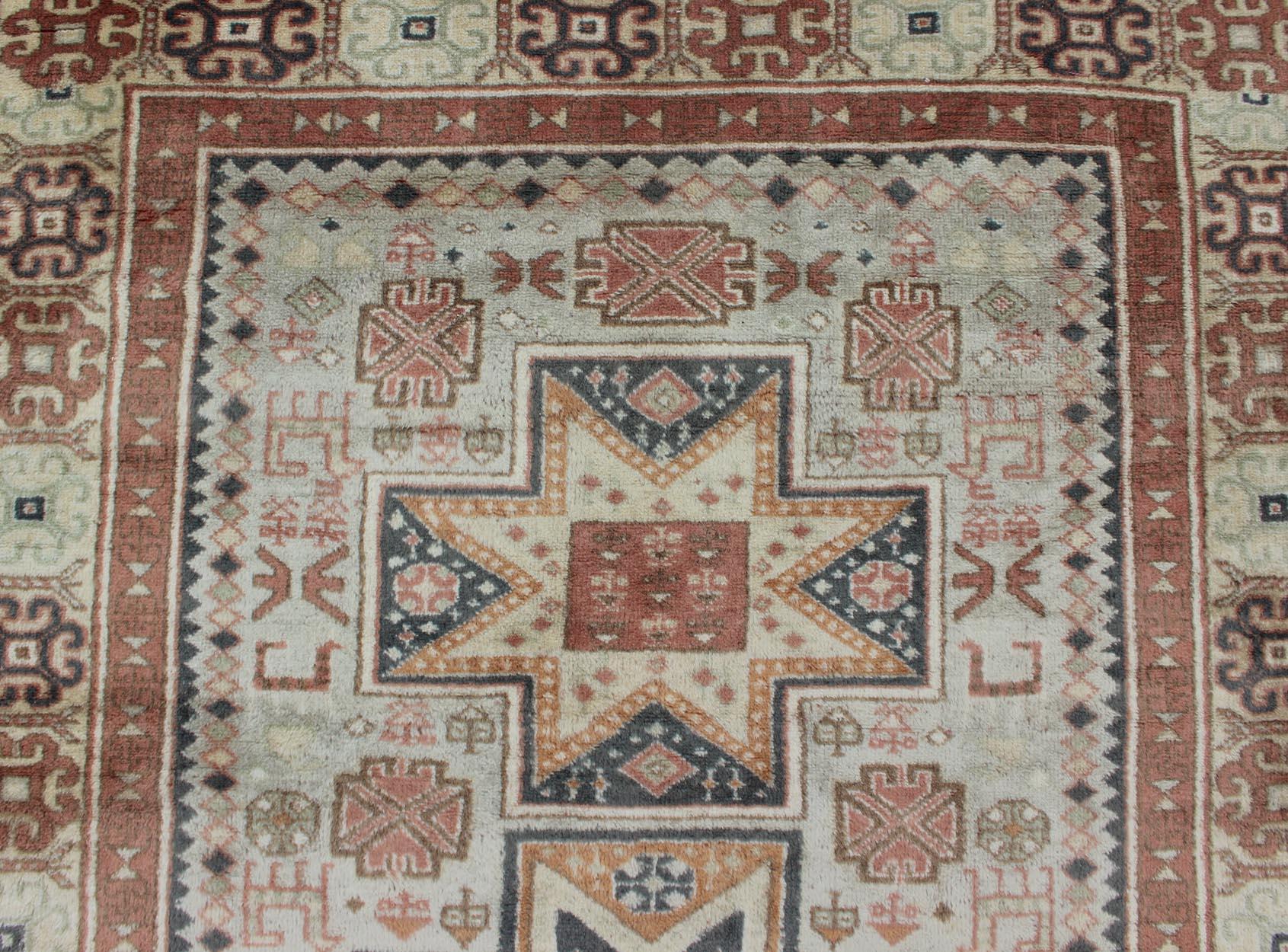 Hand-Knotted Vintage Hand Knotted Turkish Rug with Tribal Medallions and Design For Sale