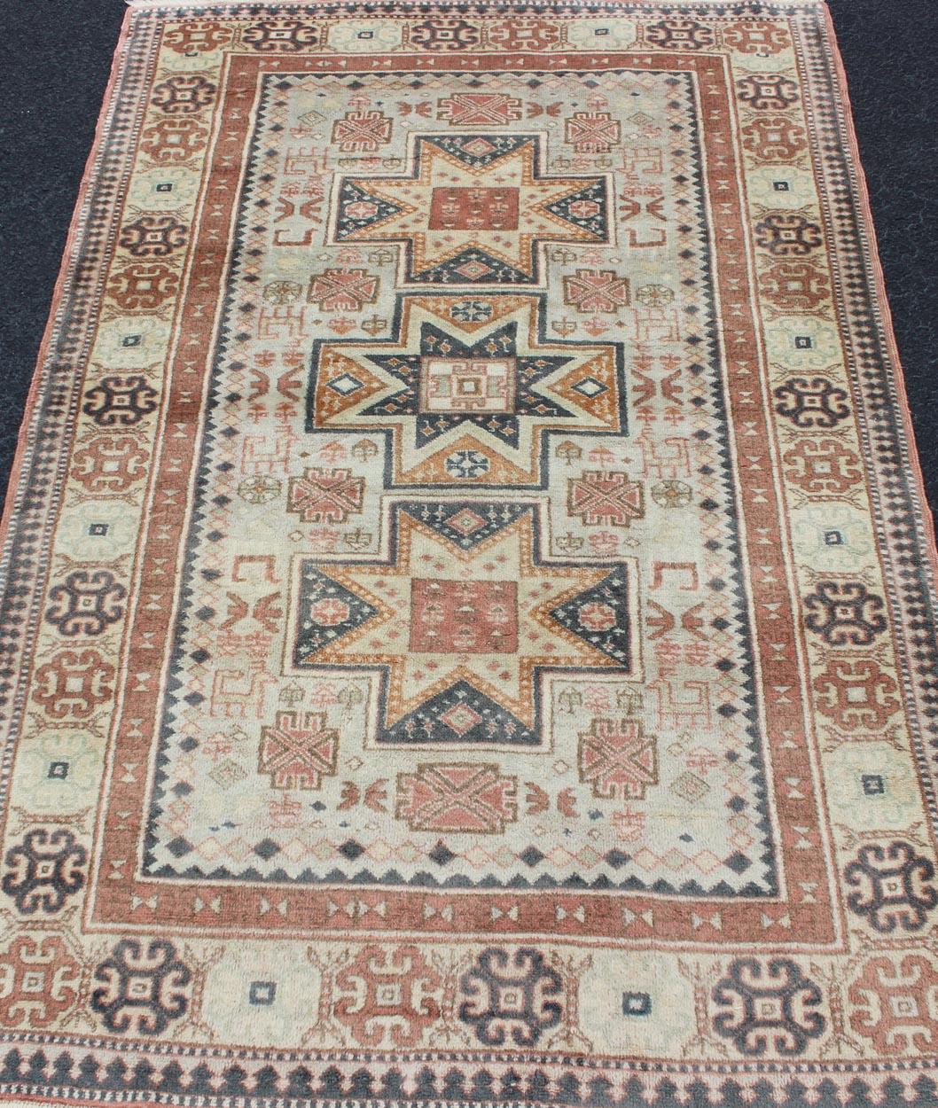 Wool Vintage Hand Knotted Turkish Rug with Tribal Medallions and Design For Sale