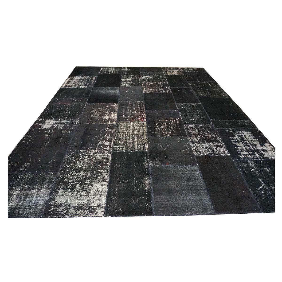  Ashly Fine Rugs presents a Vintage Turkish Patchwork 10x13 area rug. This rug a is combination of multiple handmade vintage Turkish rugs that have been masterfully cut and sewn together to create a new and modern look. The rug is mostly black with