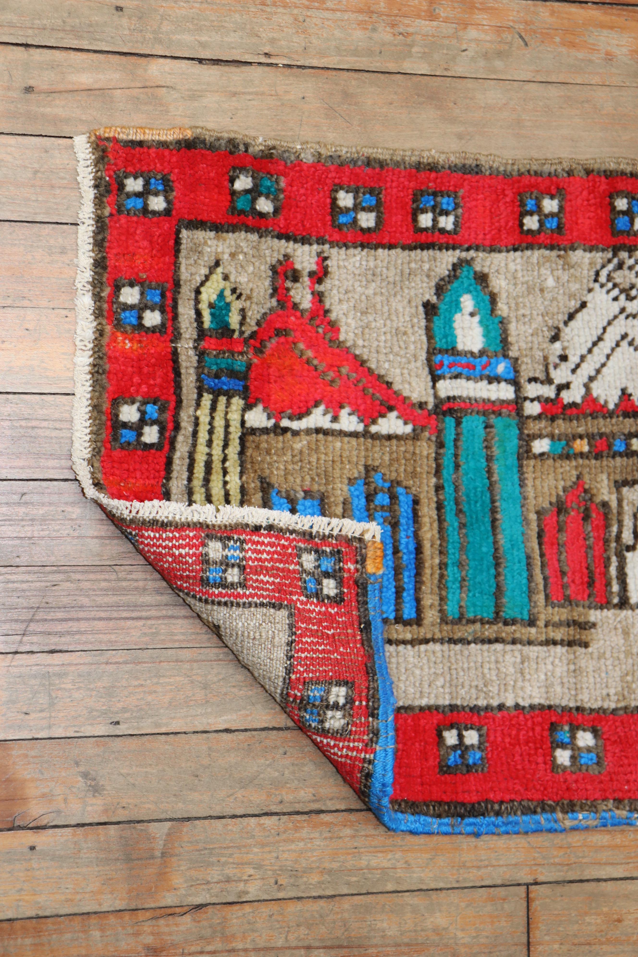 A vintage turkish throw rug depicting a colorful Mosque. 

Measures: 19