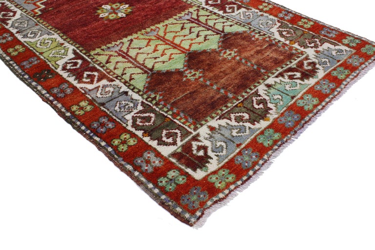 51776, vintage Turkish Oushak Accent rug, Anatolian Yuntdag Prayer rug. This hand knotted wool vintage Turkish Oushak Yuntdag prayer rug features a mihrab niche with stepped edges and latch hooks. A stylized flower floats in an abrashed burgundy