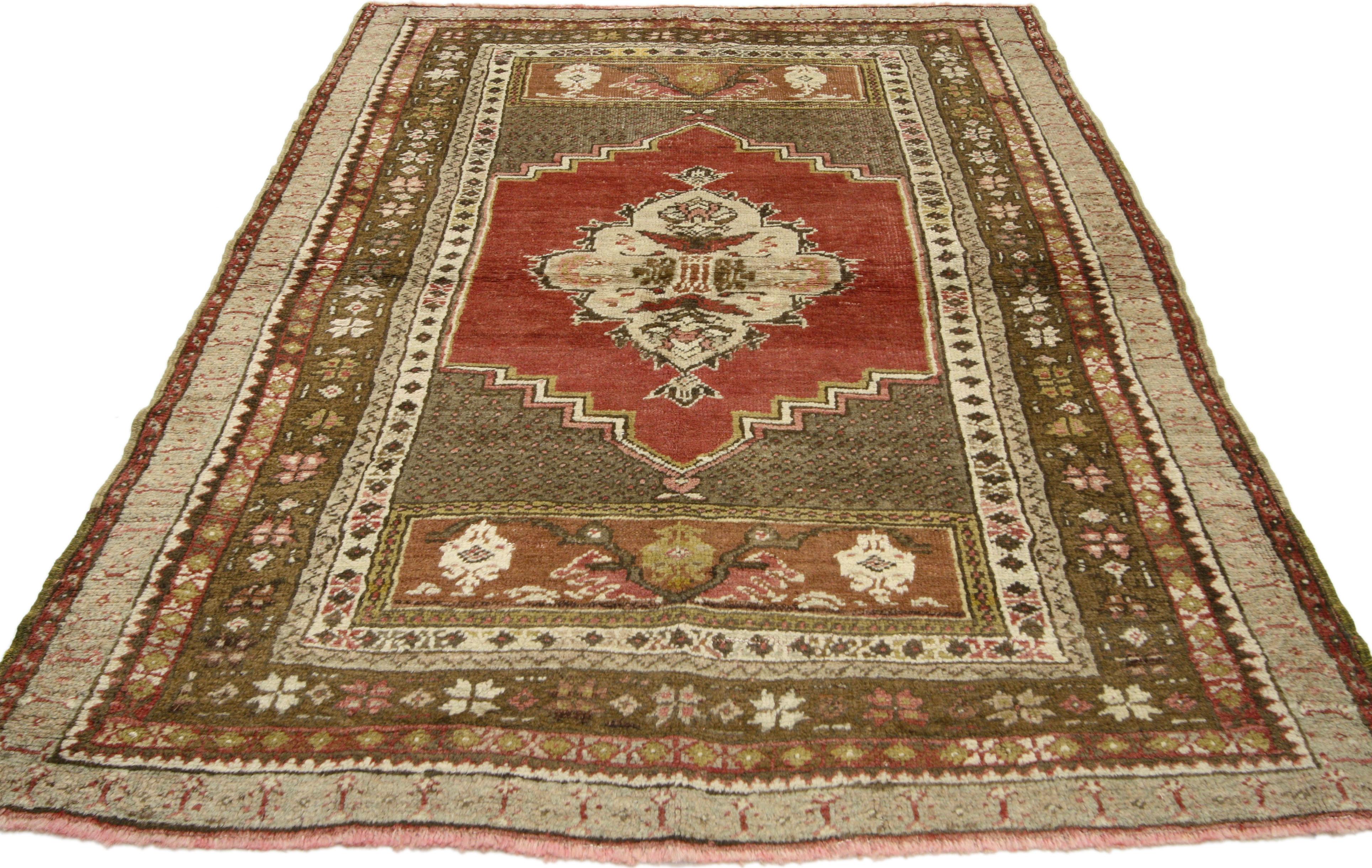 50121, a vintage Turkish Oushak rug with traditional style. This unique Turkish Oushak accent rug features a central geometric medallion of cream with a pair of lush palmettes floating on an abrashed red field outlined in a stair stepped pattern.
