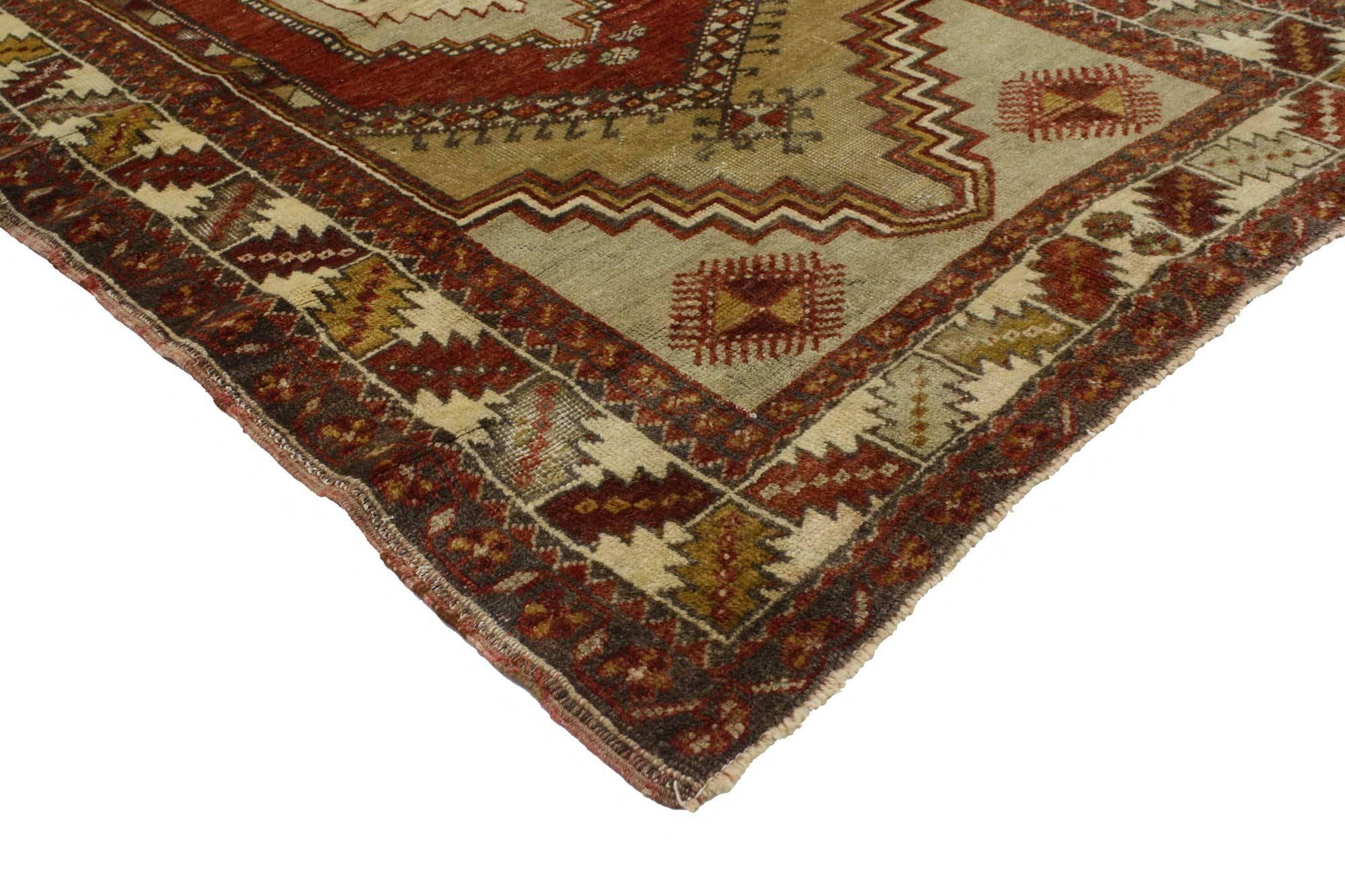 51694, vintage Turkish Oushak Accent rug with tribal style. This tribal style vintage Turkish Oushak rug is rendered in harvest colors with an expertly woven tribal motif. The Oushak accent rug features a centre amulet on a triple overlapping