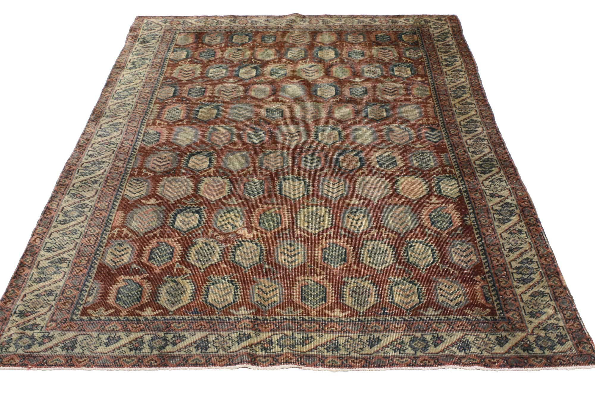 51692, distressed vintage Turkish Oushak Accent rug with all-over repeating boteh design. This vintage Turkish Oushak rug features the perfect amount of wear and displays a repetitive design of boteh motifs in a mirrored formation. Rendered in dark