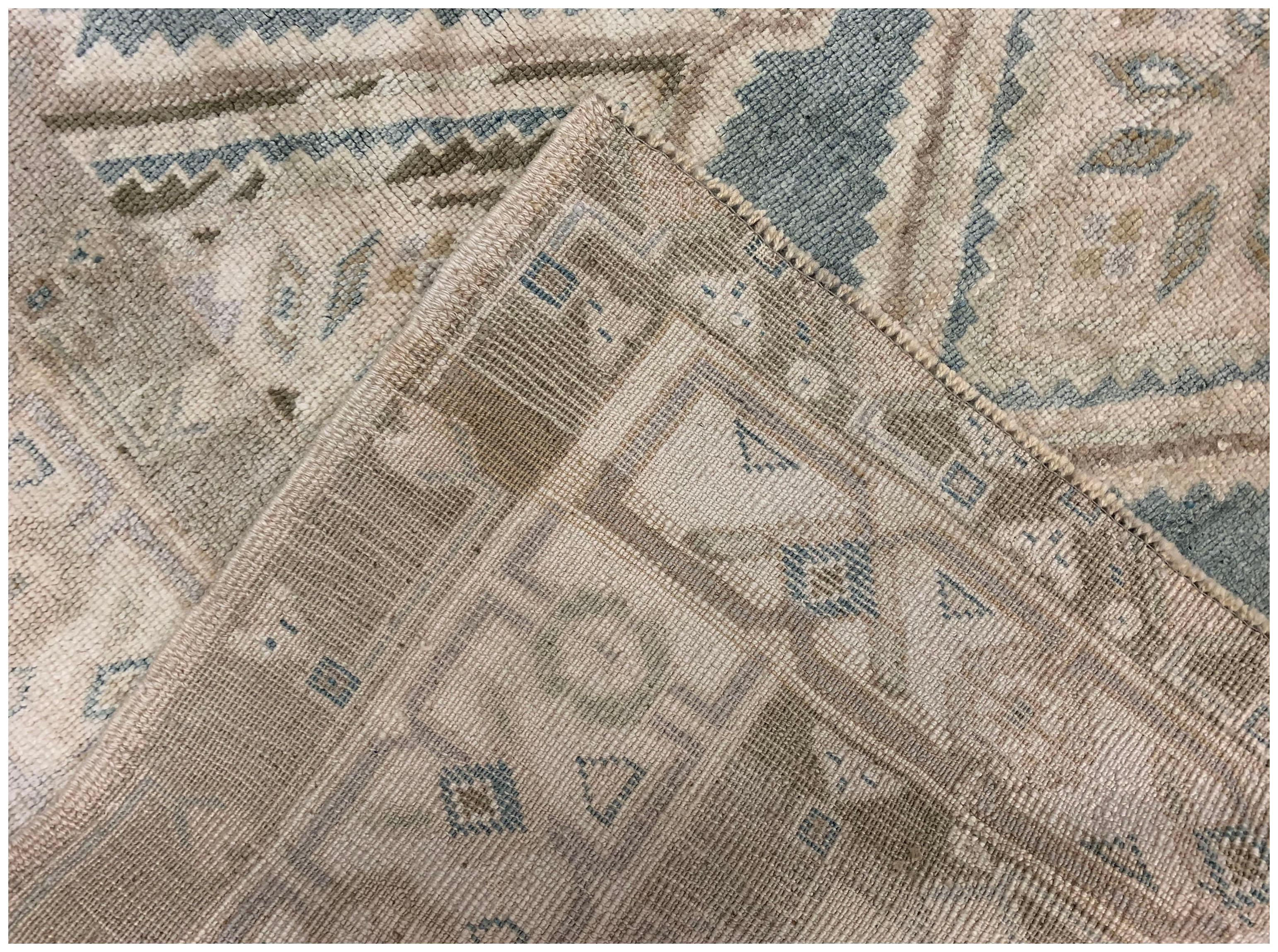 Vintage Turkish Oushak area rug, 4'7 x 6'6. Oushak's are known for their soft palettes combined with eccentric drawing. Oushak in western Turkey has the longest continuous rug weaving history, stretching back at least to the mid-fifteenth century.
