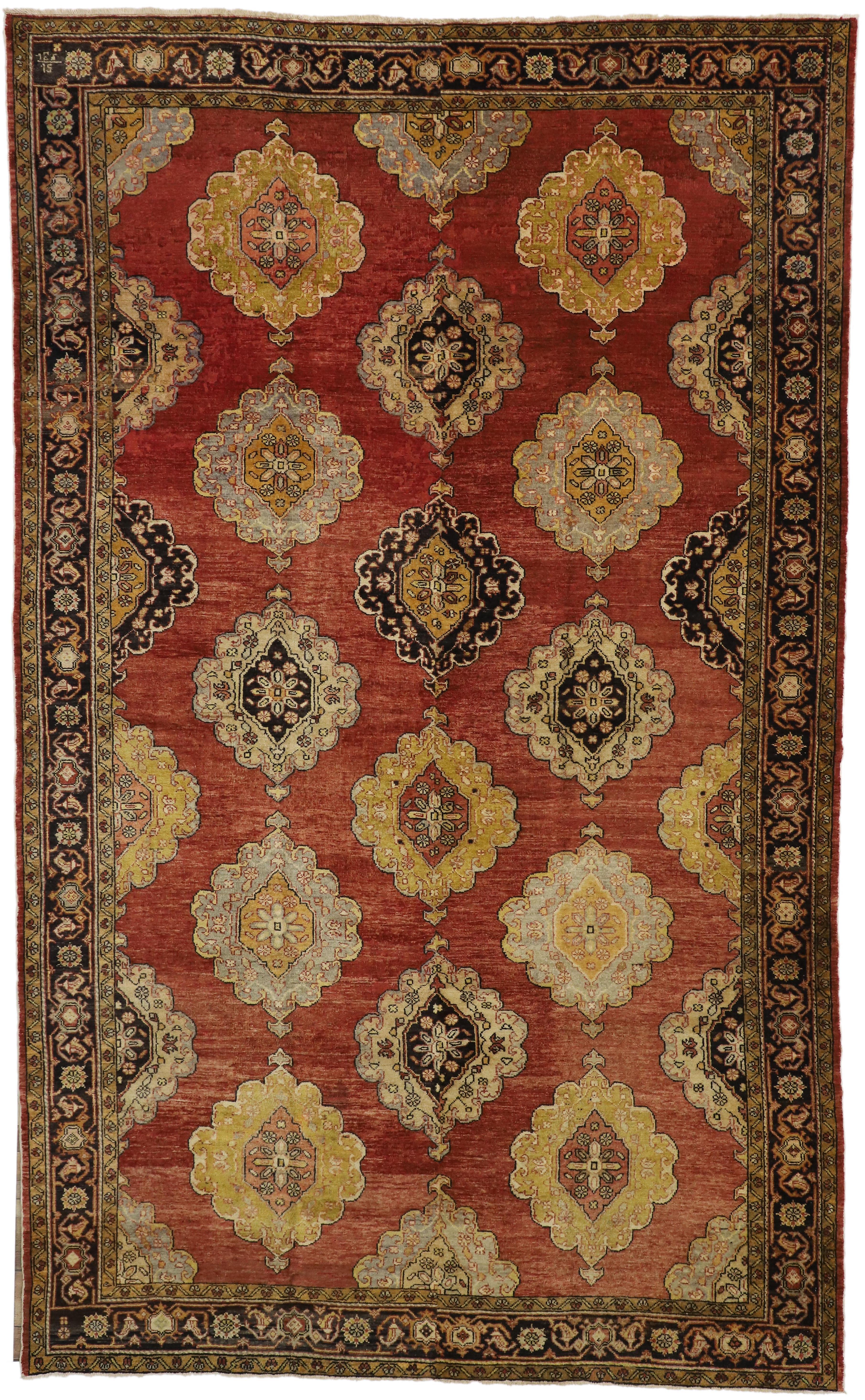 51294 Vintage Turkish Oushak Area Rug with Luxe Jacobean Style. This hand-knotted wool vintage Turkish Oushak rug features three vertical columns of cusped medallions flanked with small anchor tips at either end. Scalloped edged ziggurats protrude