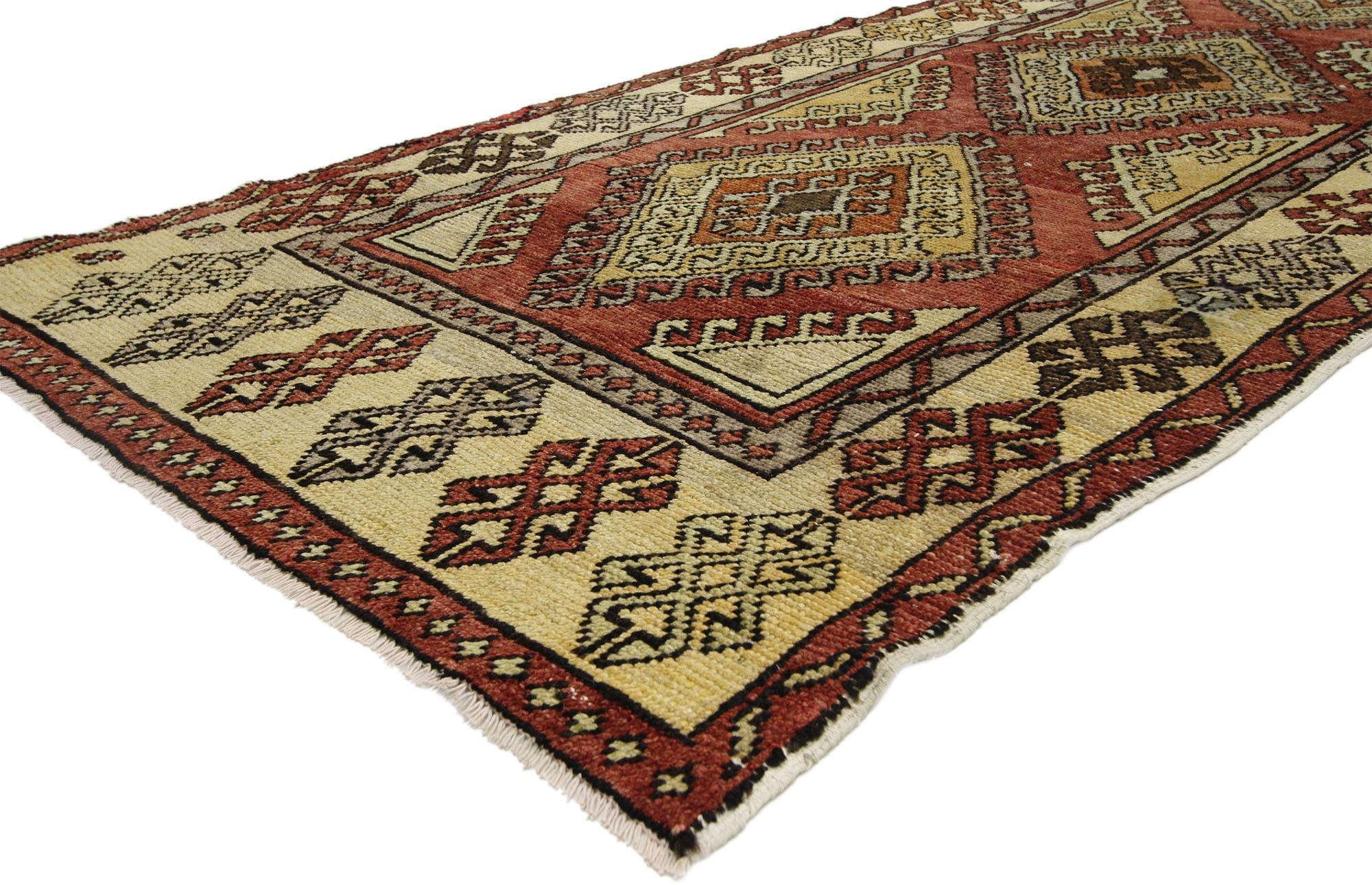 52412 Vintage Turkish Oushak Rug, 03'06 x 08'10. This vintage Turkish Oushak rug runner exemplifies the harmonious blend of tribal allure and the rich culture of Anatolian heritage. The hand-knotted wool construction lays a robust foundation for the