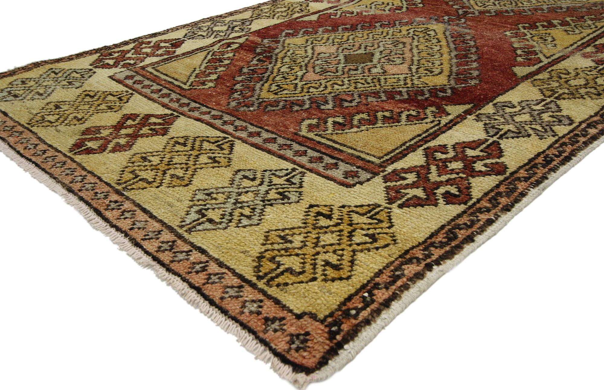 52413 Vintage Turkish Oushak Rug, 03'06 x 08'07. This vintage Turkish Oushak rug runner beautifully exemplifies the rich tradition of Anatolian weaving. Its hand-knotted wool craftsmanship highlights an abrashed red field that serves as a vibrant