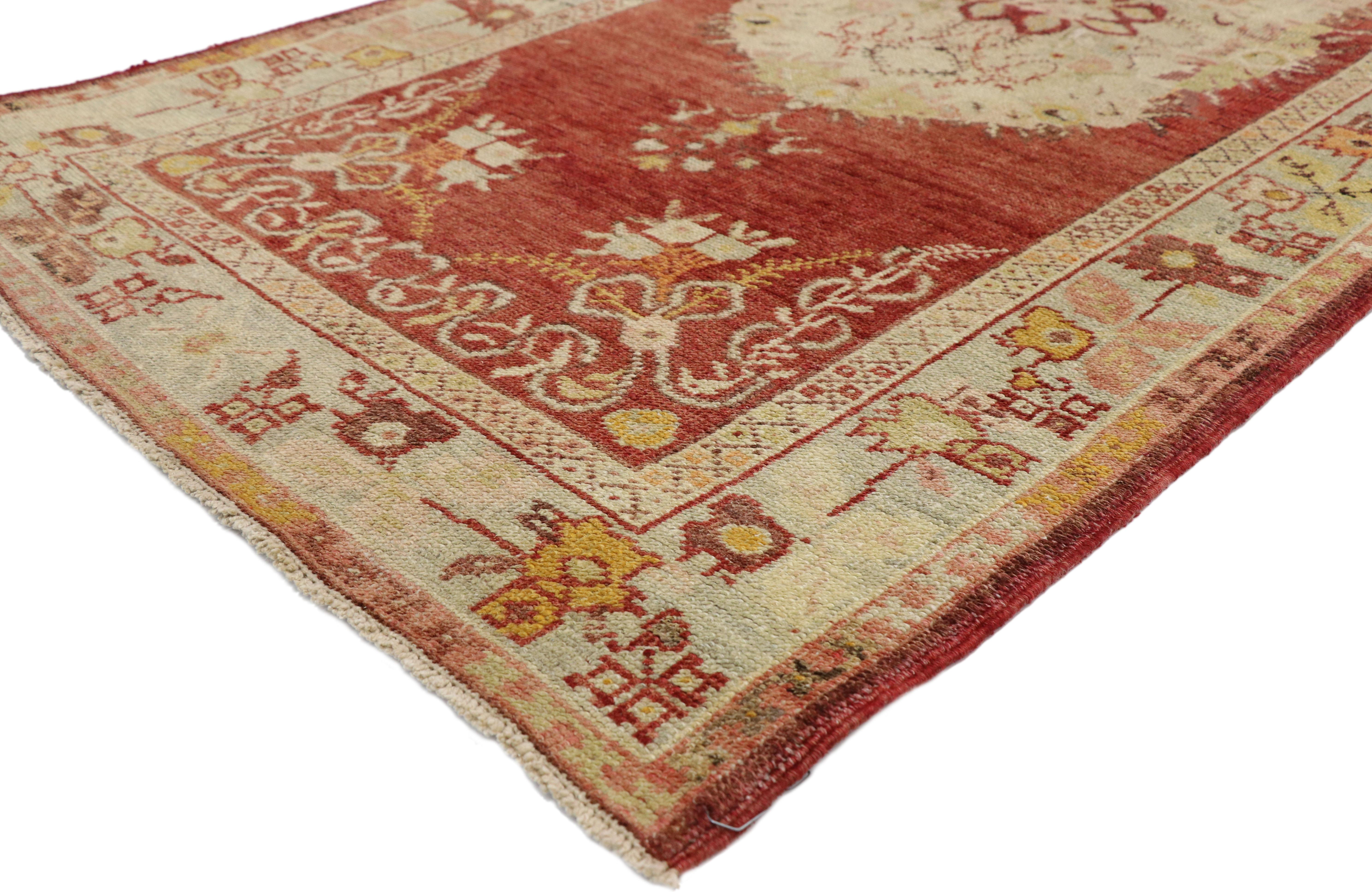 51043 Vintage Turkish Oushak Hallway Runner with Rustic French Rococo Style. This hand-knotted wool vintage Turkish Oushak runner features three round central medallions filled with stylized geometric flowers to the centre. The floating medallions